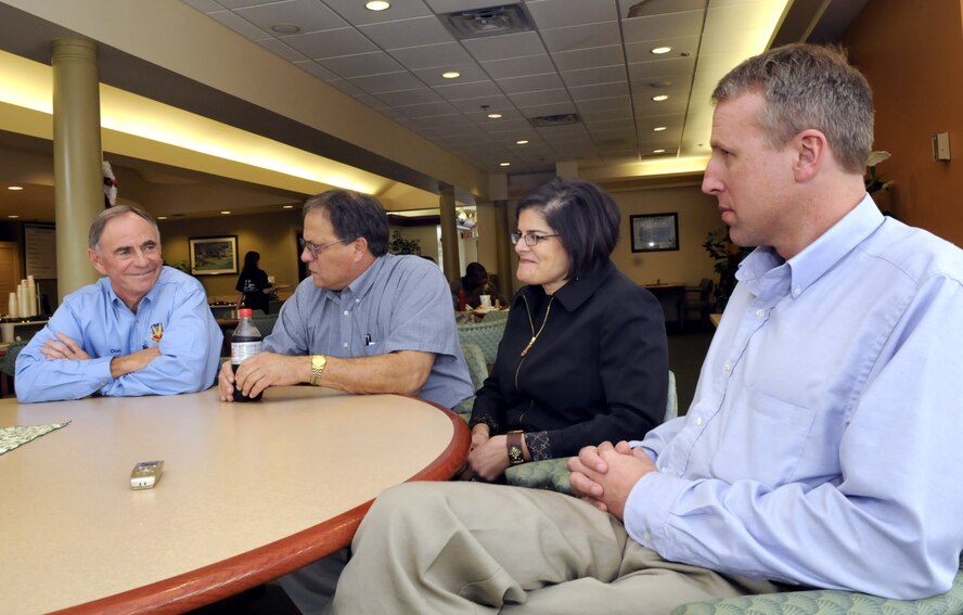 Don Doles, Craig Habakangas, Maria Elena Stopher and Matthew Bohnert, HQE's, take a break before participating in a working lunch at Robins Dec. 16. U. S. Air Force photo by Sue Sapp