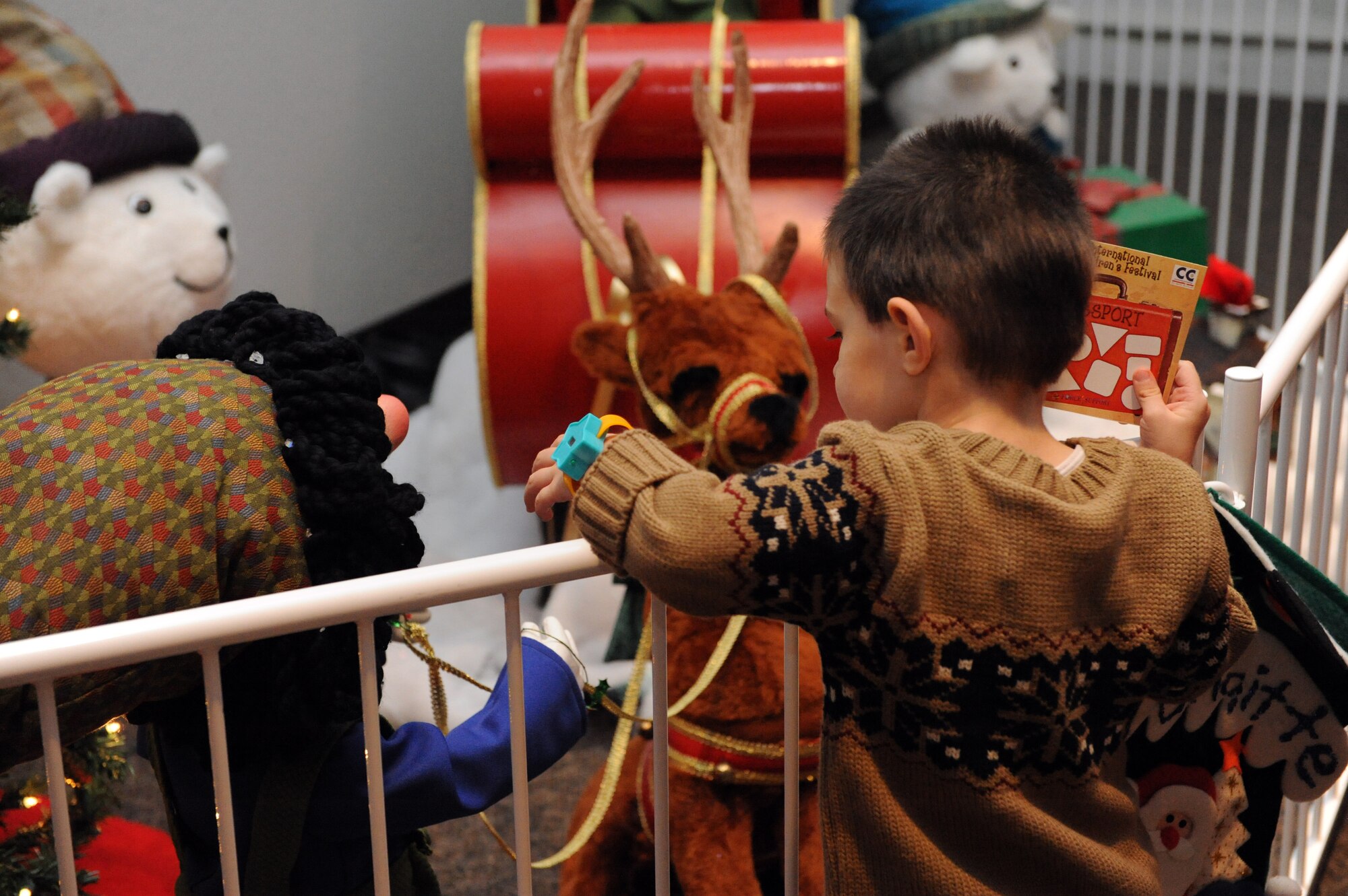 A Holloman child checks out the holiday display during the International Children's Festival at the Community Center at Holloman Air Force Base, N.M., Dec. 13. The Community Center held many holiday displays showcasing different countries traditions. (U.S. Air Force photo/Airman 1st Class Sondra Escutia)