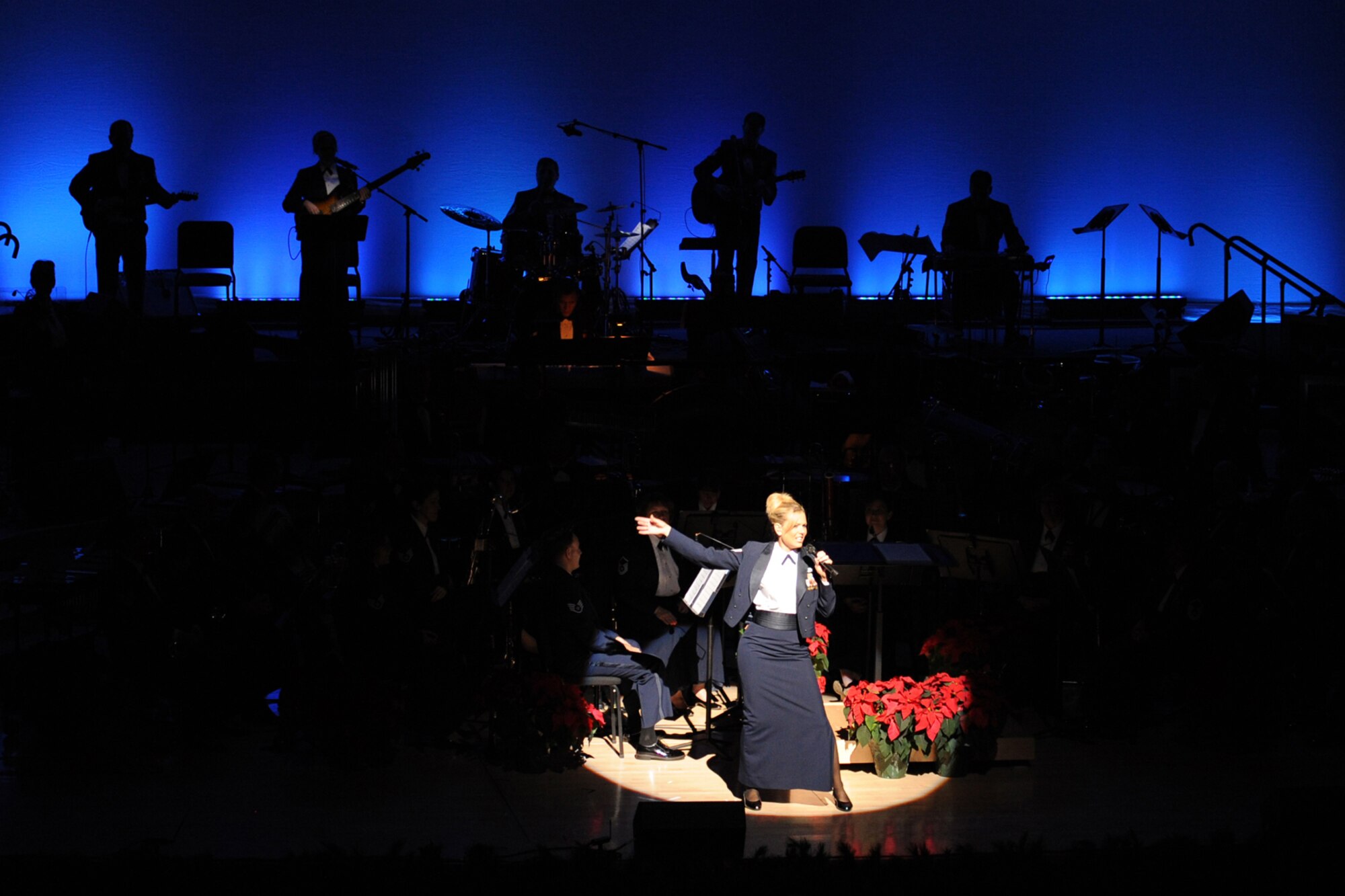 TSgt Lara Murdzia from the Heartland of America Band sings during  "The Promise of the Season" holiday concert at the Holland Performing Arts Center Dec. 11. A special concert was performed for children from area schools. (U.S. Air Force Photo By Jeff Gates)