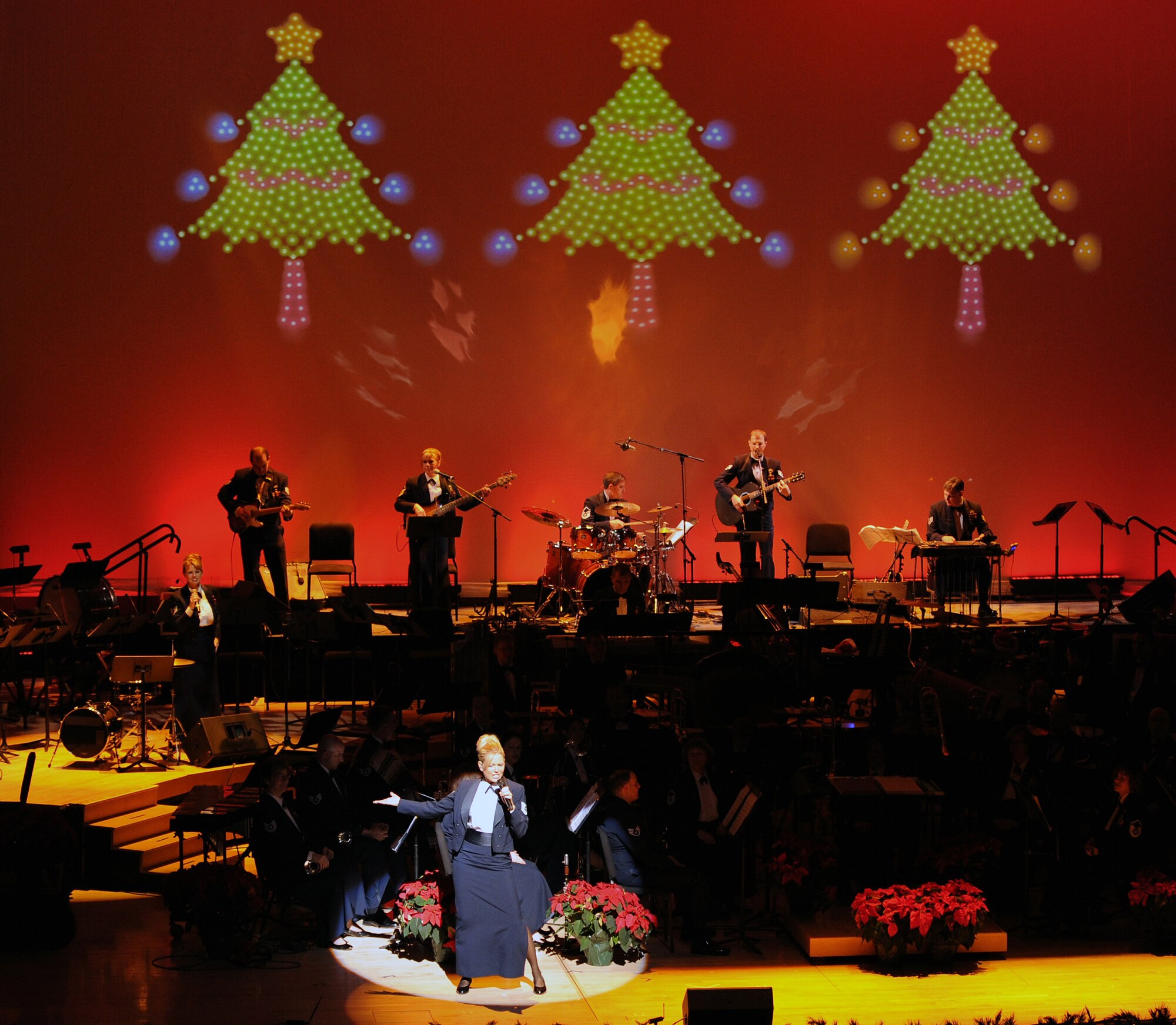 TSgt Lara Murdzia from the Heartland of America Band sings during "The Promise of the Season" holiday concert at the Holland Performing Arts Center Dec. 11. A special concert was performed for children from area schools. (U.S. Air Force Photo By Jeff Gates)