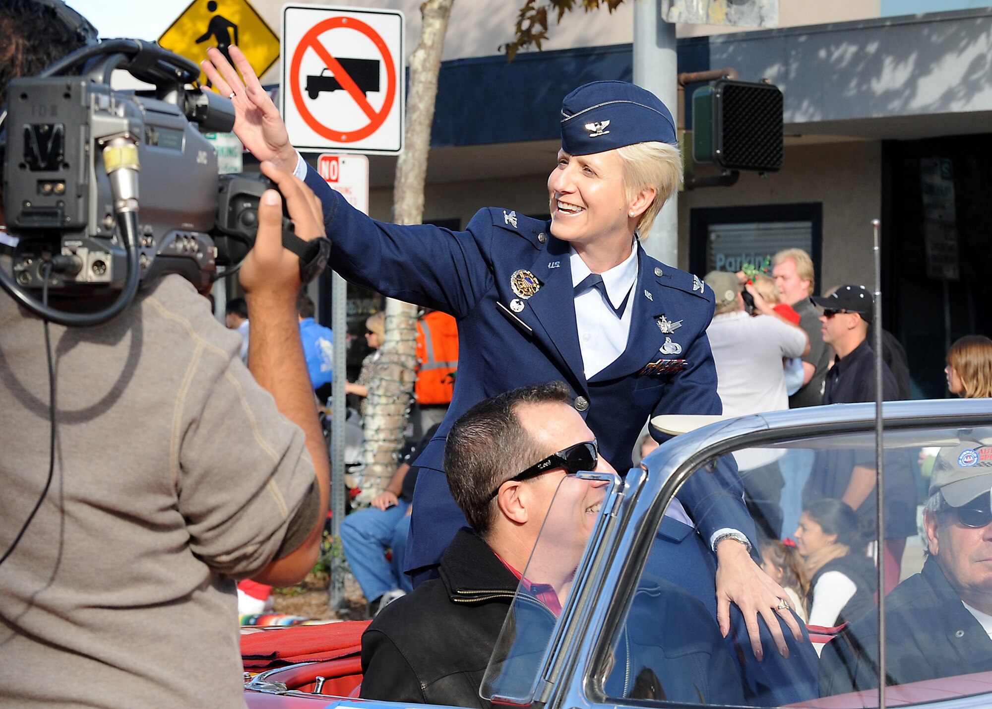 Col. Anita Latin, 61st Air Base Wing commander, rides in a vintage 1957 Thunderbird in the 45th Annual El Segundo Holiday Parade, Dec. 14. The Los Angeles Air Force Base Honor Guard also represented the base in the annual event, which included local dignitaries, marching bands, and community groups. (Photo by Joe Juarez)