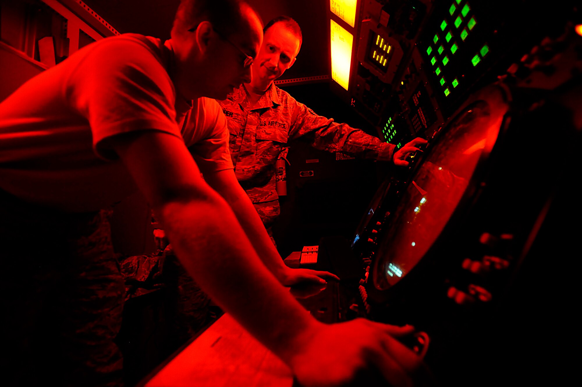 Airman 1st Class Nathaniel Kearn and Staff Sgt. Christopher Loper verify radar data during a preventive maintenance inspection on a mobile radar system at Joint Base Balad, Iraq, Dec. 18. The Airmen are deployed from Mountain Home Air Force Base, Idaho. Kearn, a 727th Expeditionary Air Control Squadron ground radar systems apprentice, is a Harrah, Okla., native. Loper, a 727th EACS ground radar systems supervisor, is a Houston native. (U.S. Air Force photo/Airman 1st Class Jason Epley)(Released)