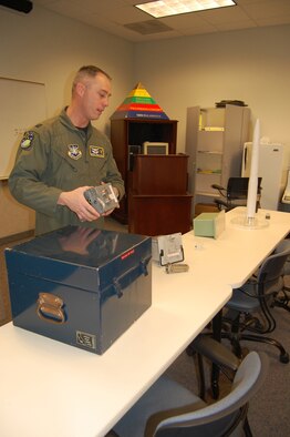Capt. Darrel DeLeon, 341st Operation Support Squadron chief of ICBM wing codes operations, explains the uses of different code components that interact from the launch control capsule in the field to the intercontinental ballistic missile in the silo. Codes are used to ensure the security of the weapons and have a vital role in helping accomplish the mission of the 341st OSS. (U.S. Air Force photo/Senior Airman Emerald Ralston)