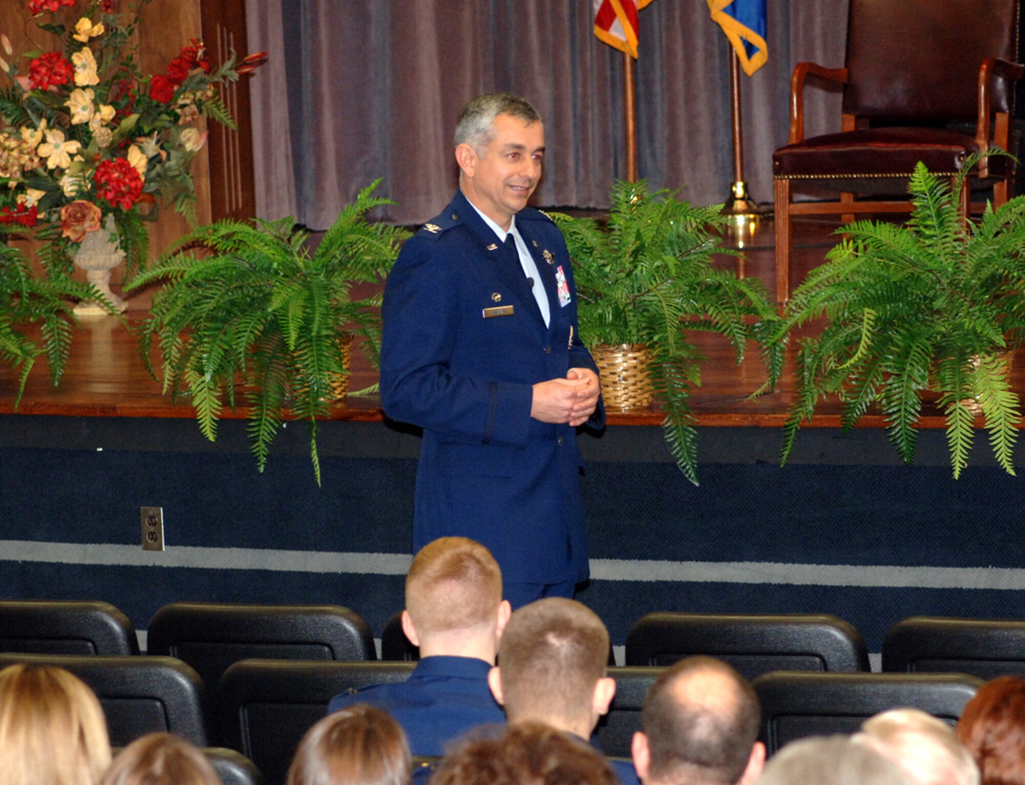 Colonel Roger Watkins, 14th Flying Training Wing commander, delivers the keynote address to the graduates of Specialized Undergraduate Pilot Training class 09-03 in a ceremony held at Kaye Auditorium Friday. (U.S. Air Force photo by Airman 1st Class Josh Harbin)