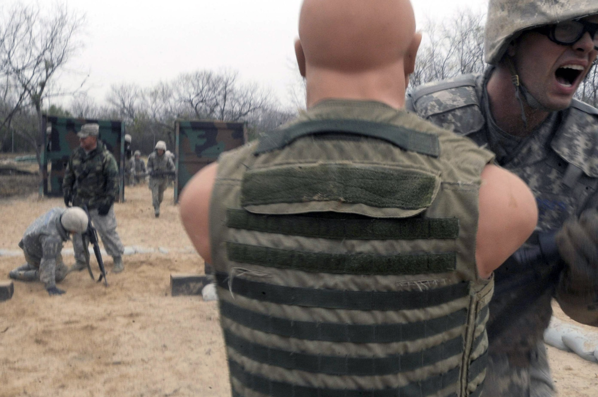 An Airman Basic trainee in body armor hits a strike-dummy as he makes his way through the tactical drill course during the five-day deployment exercise called the Basic Expeditionary Airman Skills and Training, or BEAST, which kicked off Dec. 15 at Lackland Air Force Base, Texas. The BEAST is the newly built complex added into the extended, 8.5-week Basic Military Training curriculum that began Nov. 5. (U.S. Air Force photo/Staff Sgt. Desiree N. Palacios)