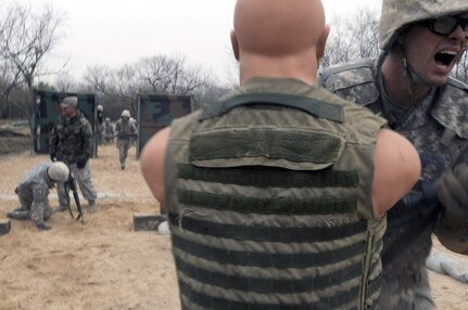 An Airman Basic trainee in body armor hits a strike-dummy as he makes his way through the tactical drill course during the five-day deployment exercise called the Basic Expeditionary Airman Skills and Training, or BEAST, which kicked off Dec. 15 at Lackland Air Force Base, Texas. The BEAST is the newly built complex added into the extended, 8.5-week Basic Military Training curriculum that began Nov. 5. (U.S. Air Force photo/Staff Sgt. Desiree N. Palacios)