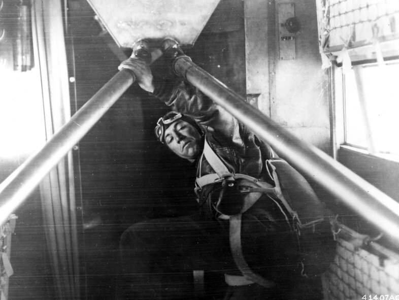 Lt. Elwood "Pete" Quesada, a member of the historic "Question Mark" aerial refueling operation, adjusts an aircraft gas line.  During a 1929 operation dubbed "Question Mark," a 10,000-pound Fokker C-2A was refueled in flight by two modified Douglas C-1 transport aircraft.  A large question mark was painted on each side of the receiver aircraft's fuselage, intended to "provoke wonder at how long the aircraft could remain airborne," according to Air Force history experts.  During the operation, which began on New Year's Day in 1929 and ended 150 hours and 40 minutes later on Jan. 7, the Douglas refueling aircraft passed 5,660 gallons of fuel.  All tolled, the tankers completed 43 sorties, 12 of which occurred at night.