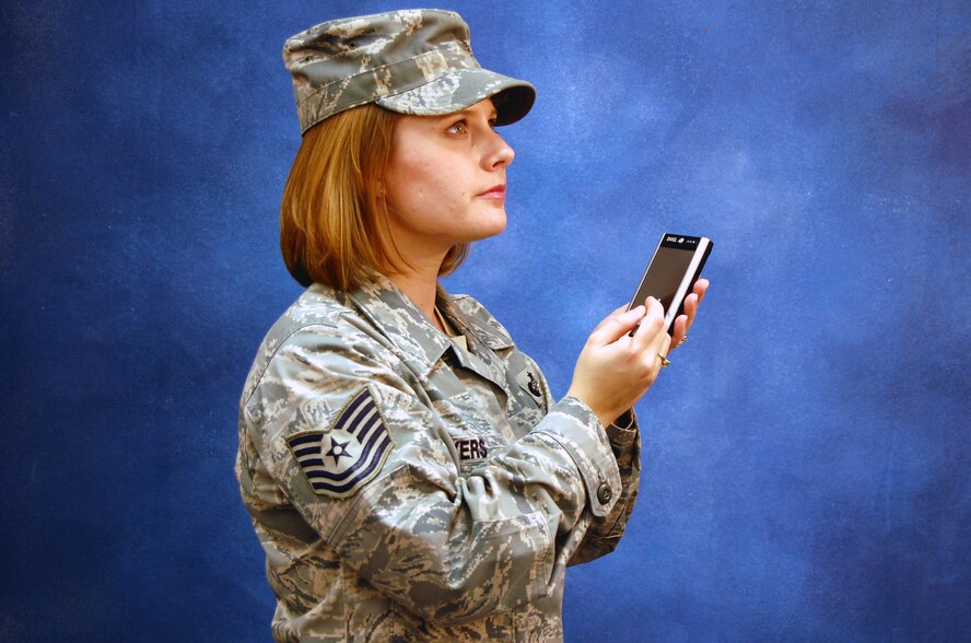 Tech. Sgt. Kristina Myers, from U.S. Air Force Expeditionary Center's command staff, models for a photo Dec. 12, 2008, in the Expeditionary Center studio on Fort Dix, N.J.  The effort was part of preparatory work by an artist from the Air Force Art Program to complete a painting highlighting Expeditionary Center Airmen. (U.S. Air Force Photo/Tech. Sgt. Scott T. Sturkol)