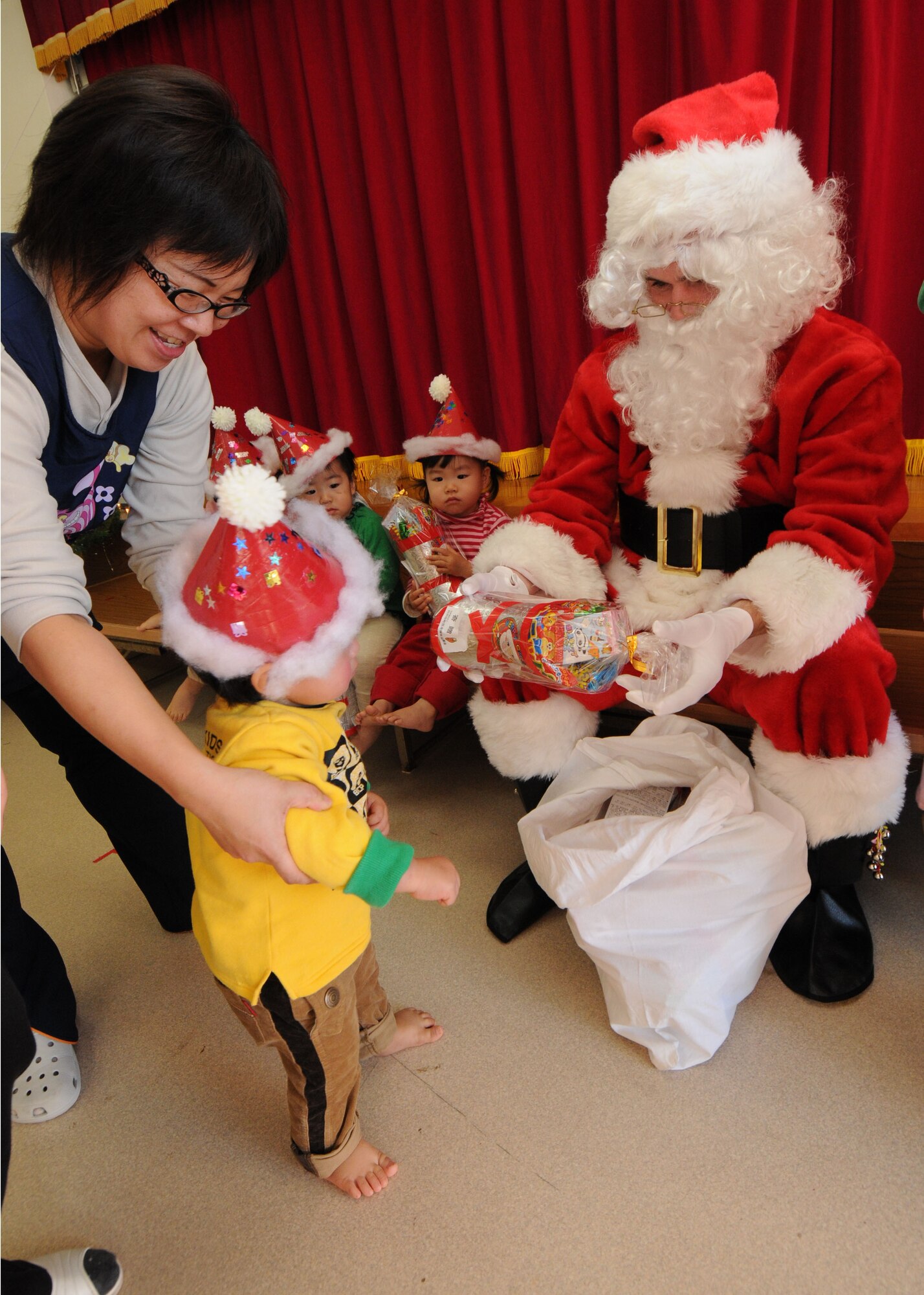 YOKOTA AIR BASE, Japan -- Airman Sean Martin from the 374th Airlift Wing Public Affairs office  visits children at the Taisho elementary school, Hinoda City, Dec. 18. While there, Airman Martin also handed out gifts and answered any question they had for Santa.
(U.S. Air Force photo by Senior Airman Veronica Pierce)