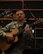 YOKOTA AIR BASE, Japan -- Staff Sgt. Daniel Bragdon from the U.S. Band of Pacific - Asia strums on his acoustic guitar during a practice session Dec. 18. Sergeant Bragdon and other band members performed Christmas carols across the base spreading holiday cheer. (U.S.  Air Force photo by Senior Airman Brian Kimball)