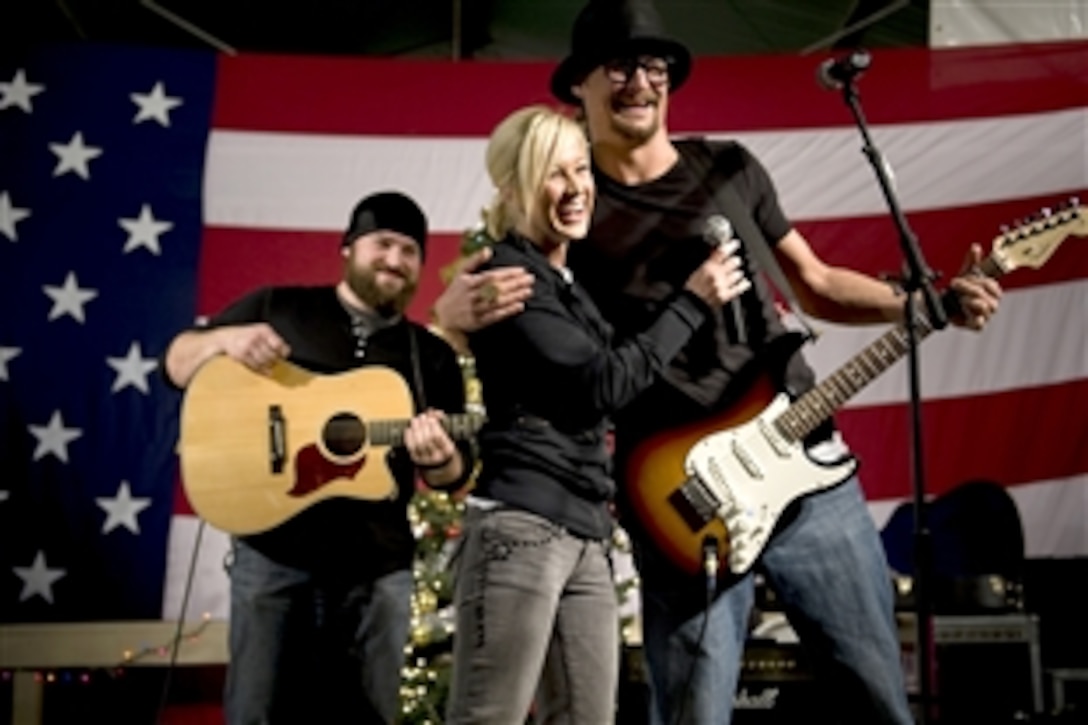 Grammy award-winning musician Kid Rock, American Idol contestant and country musician Kellie Pickler, and musician Zack Brown entertain troops stationed at Kandahar, Afghanistan, Dec. 17, during the 2008 USO Holiday Tour. 
