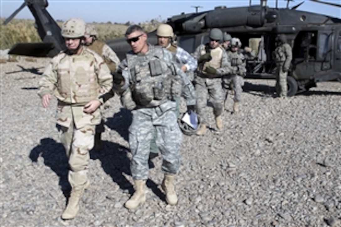 U.S. Army Maj. Gen. Robert Caslen, right, commanding general, Multinational Division North, gives U.S. Navy Adm. Mike Mullen, chairman of the Joint Chiefs of Staff, a tour of Patrol Base Olsen, Samarra, Iraq,  Dec. 18, 2008. 
