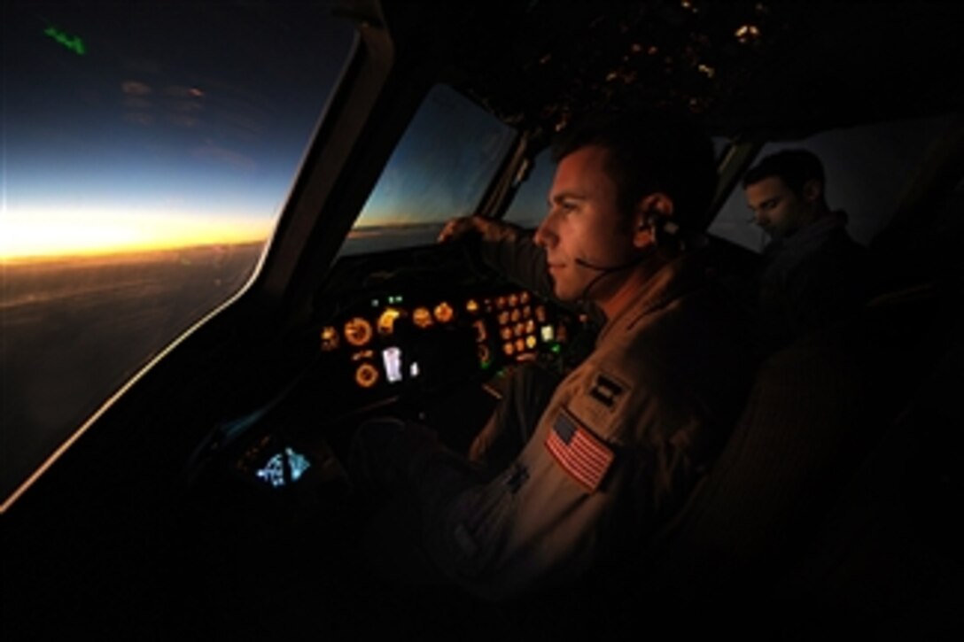 U.S. Air Force KC-10 Extender tanker pilot Capt. Justin Simms from the 908th Expeditionary Aerial Refueling Squadron pilots the aircraft on a combat mission over Afghanistan on Dec. 15, 2008.  