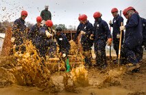 Students in the basic course at the Chemical, Biological Incident Response Force remove debris at the opening as they try to enter a simulated building collapse in search of survivors. More than 400 Marines, sailors and civilians are assigned to the specialized unit that trains around the United States to decontaminate and extract victims from a disaster site.