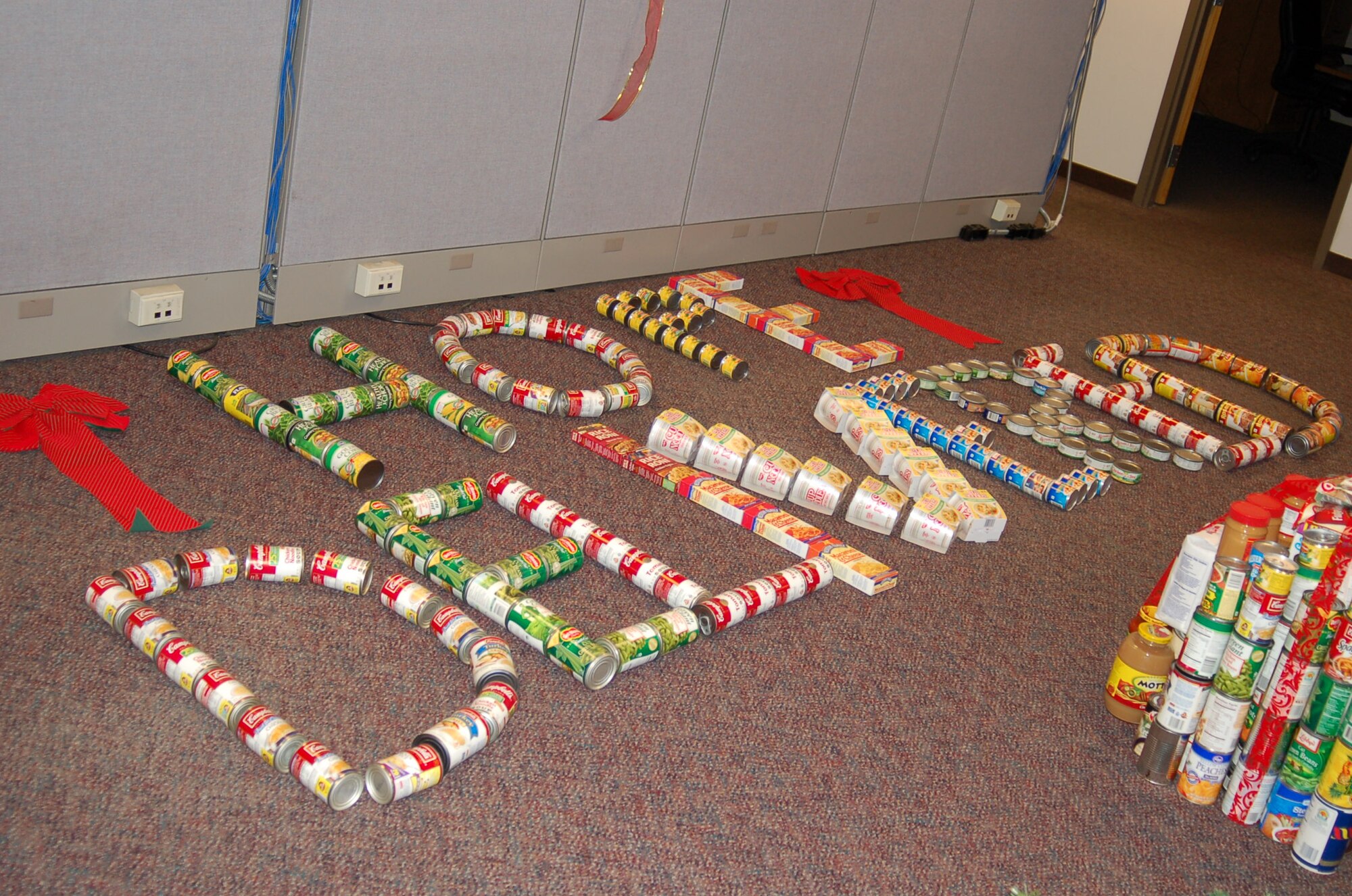 “Help Delivered,” the slogan for the Combined Federal Campaign, was the theme for the canned food display in the 526th Electronics Maintenance Squadron.  The five 309th Electronics Maintenance Group squadrons held a competition to collect food items and display them in a Christmas setting. The more than 2,200 food items, clothing and toys collected will be taken to local charities.