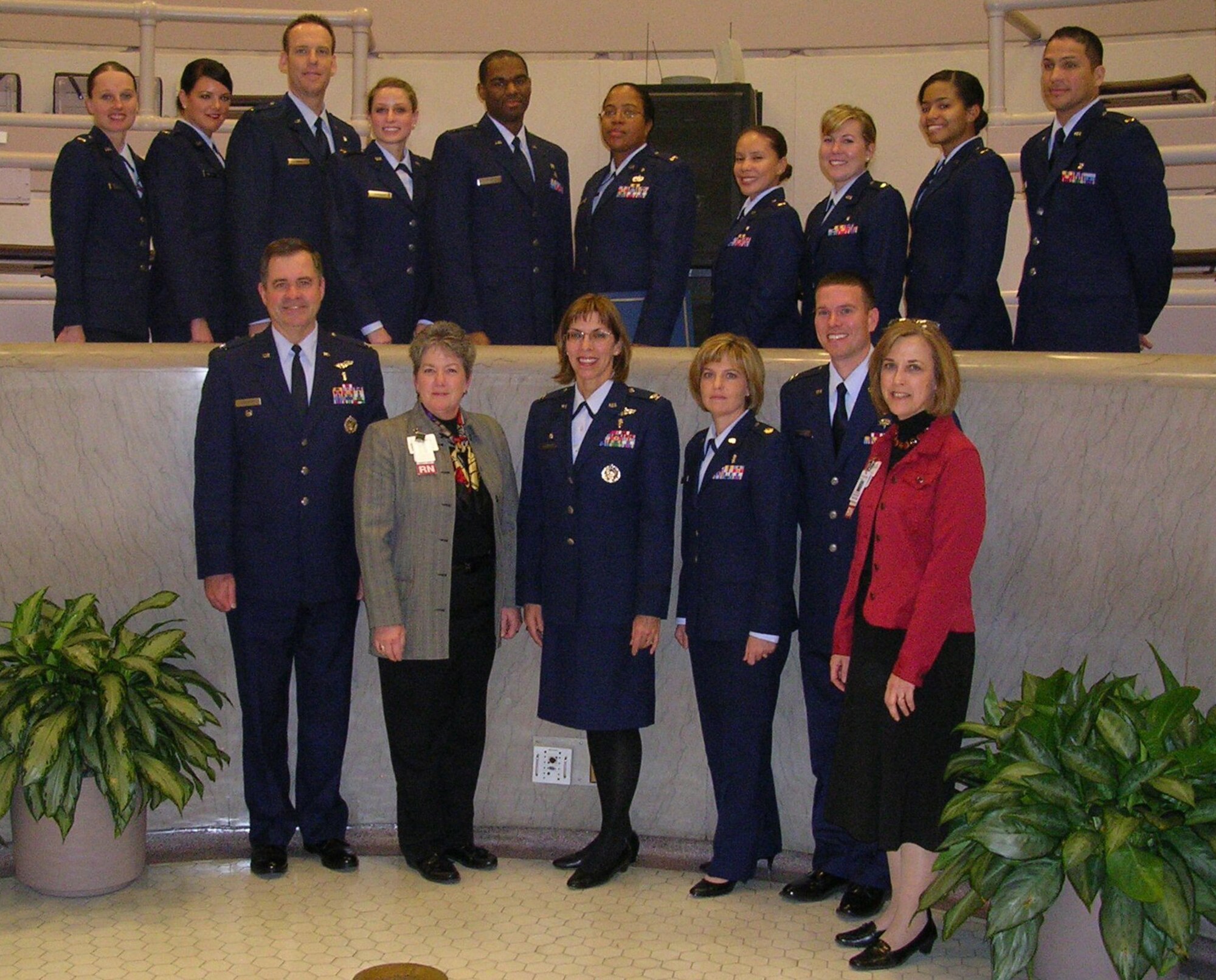 Members of the first graduating class for the Nurse Transition Program at University Hospital Cincinnati on Dec. 11.  Top row (L-R) are second lieutenants Jessica Roberts, Candice Walter, Christopher Price, Sarabeth Hershey, Joseph Harvey, Sharon Eleby, Lisis Davila, Dona Brady, Maureceia Autry, and Isaac Andino.  Bottom row are Air Force and hospital officials: Col. Thomas Langston, chief nurse, 88th Medical Group at Wright-Patterson Medical Center; Cindy Campbell, director of nursing operations, Univ. Hospital; Col. Kimberly Slawinski, commander, 88th Medical Group; Maj. Christine Berberick, chief of the Nurse Transition Program; Capt. Joshua Lundquist, course supervisor; and Amy Costanzo, manager of clinical education, University Hospital.  (U.S. Air Force photo/Mike Frangipane) 