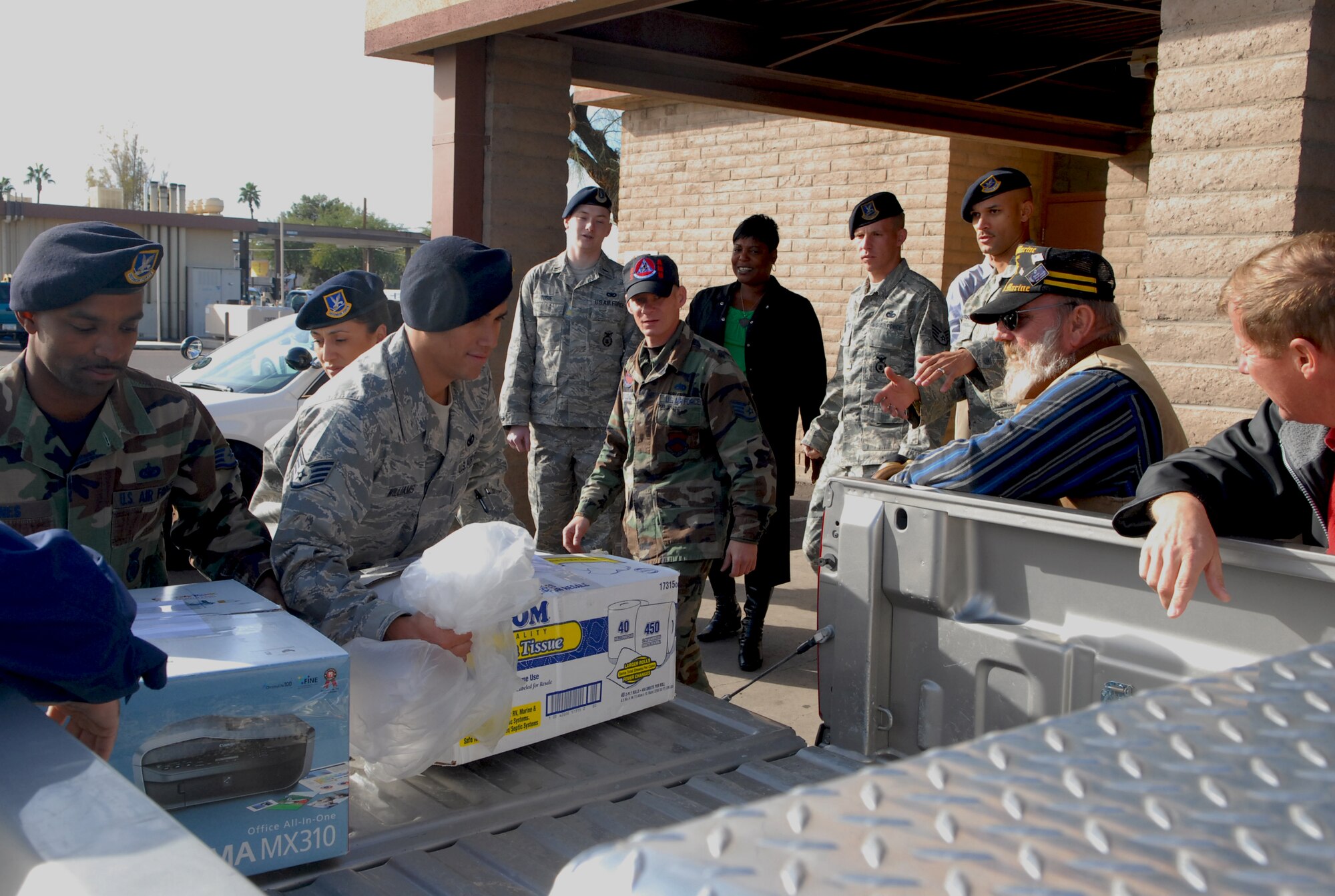 Members of 56th Security Forces Squadron unload boxes of donated items to be sent to deployed servicemembers. Tom Sloan of Desert Tunes delivered to security forces 15 boxes containing more than 3,000 items ranging from personal hygiene to boxes of candy. “We plan on sending some of the items to our members who are deployed,” said Chief Master Sgt. Patrick Wilson, 56th SFS superintendent. “The rest we’re giving to Operation Thunderbox to be delivered to other deployed Luke members.”