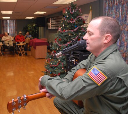 Senior Master Sgt, Gary Smith gets ready tp sing a Christmas carol for the veterans at the Soldiers' Home in Holyoke, Mass., Dec. 18. Sergeant Smith and more than 30 other reservists from the 439th Airlift Wing at Westover paid a holiday visit to the veterans, providing music, serving coffee and cookies, and sharing conversations. (US Air Force photo/Tech. Sgt. Andrew Biscoe)