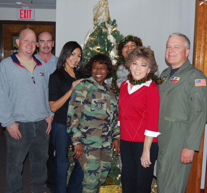 Alamo Wing commander, Brig. Gen. John Fobian, right, and members of the 433rd Airlift Wing Command Staff, wish a safe and Happy Holiday season to members, friends and neighbors of the Alamo Wing. (U.S. Air Force Photo/Ms. Elsa Martinez) 