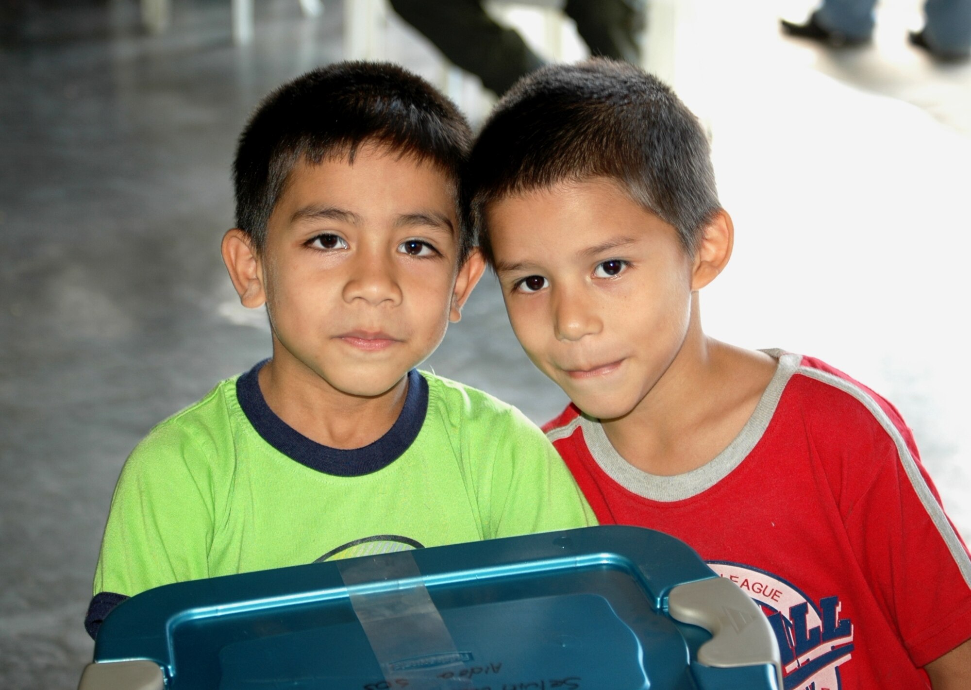 Two Honduran children receive their container full of gifts recently as part of the 1st Special Operations Wing's annual OPERATION CHRISTMAS WISH. This year marked the 16th iteration of the event, in which Airmen from the 6th Special Operations Squadron delivered supplies to multiple Honduran orphanages and conducted joint military training with U.S. forces abroad. (U.S. Air Force Photo/2nd Lt. Mark Lazane)