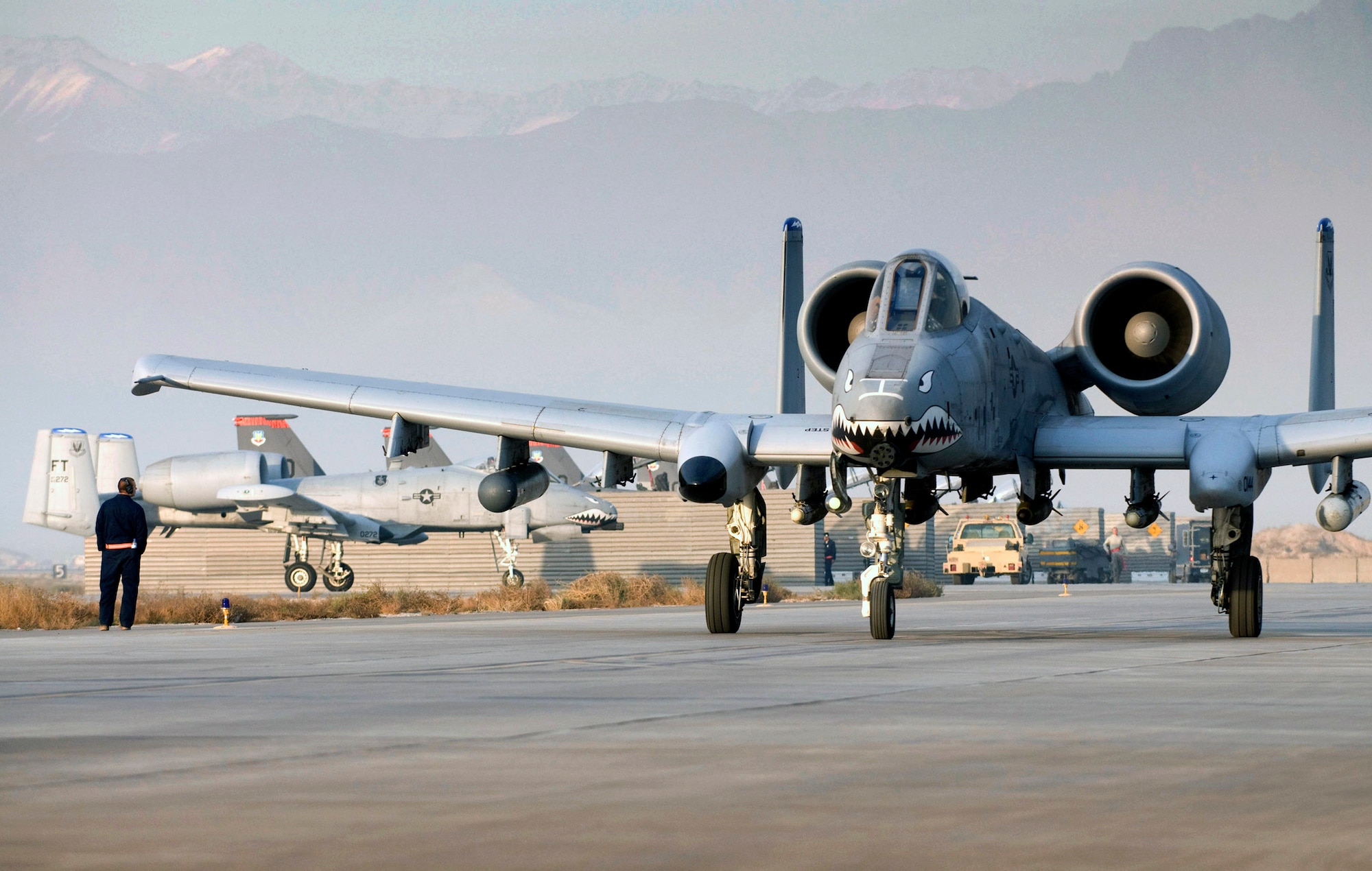 Capt. Eric Fleming taxies an A-10 Thunderbolt II Dec. 2 on the flightline at Bagram Airfield, Afghanistan. The teeth painted on the nose of the aircraft symbolizes the legacy of the fighter squadron, dating back to the Flying Tigers of World War II. Captain Fleming is the assistant wing weapons and tactics officer and an A-10 pilot. He is deployed from Moody Air Force Base, Ga., and hails from Philadelphia. (U.S. Air Force photo/Staff Sgt. Samuel Morse)