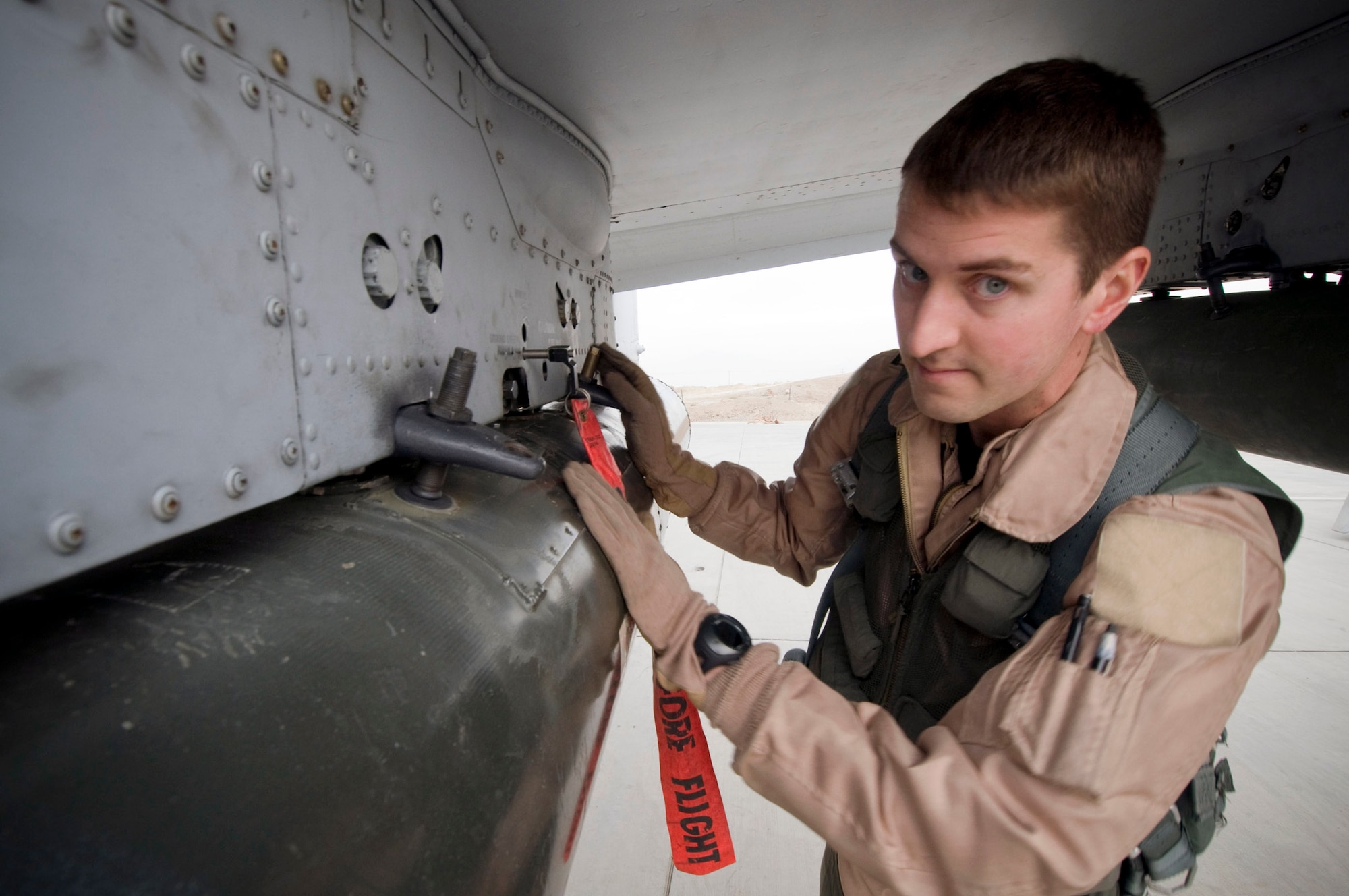 Capt. Eric Fleming performs a preflight inspection of a guided bomb unit-12 on an A-10 Thunderbolt II Dec. 2 at Bagram Airfield, Afghanistan. Captain Fleming is the assistant wing weapons and tactics officer and an A-10 pilot. He is deployed from Moody Air Force Base, Ga., and hails from Philadelphia. (U.S. Air Force photo/Staff Sgt. Samuel Morse) 