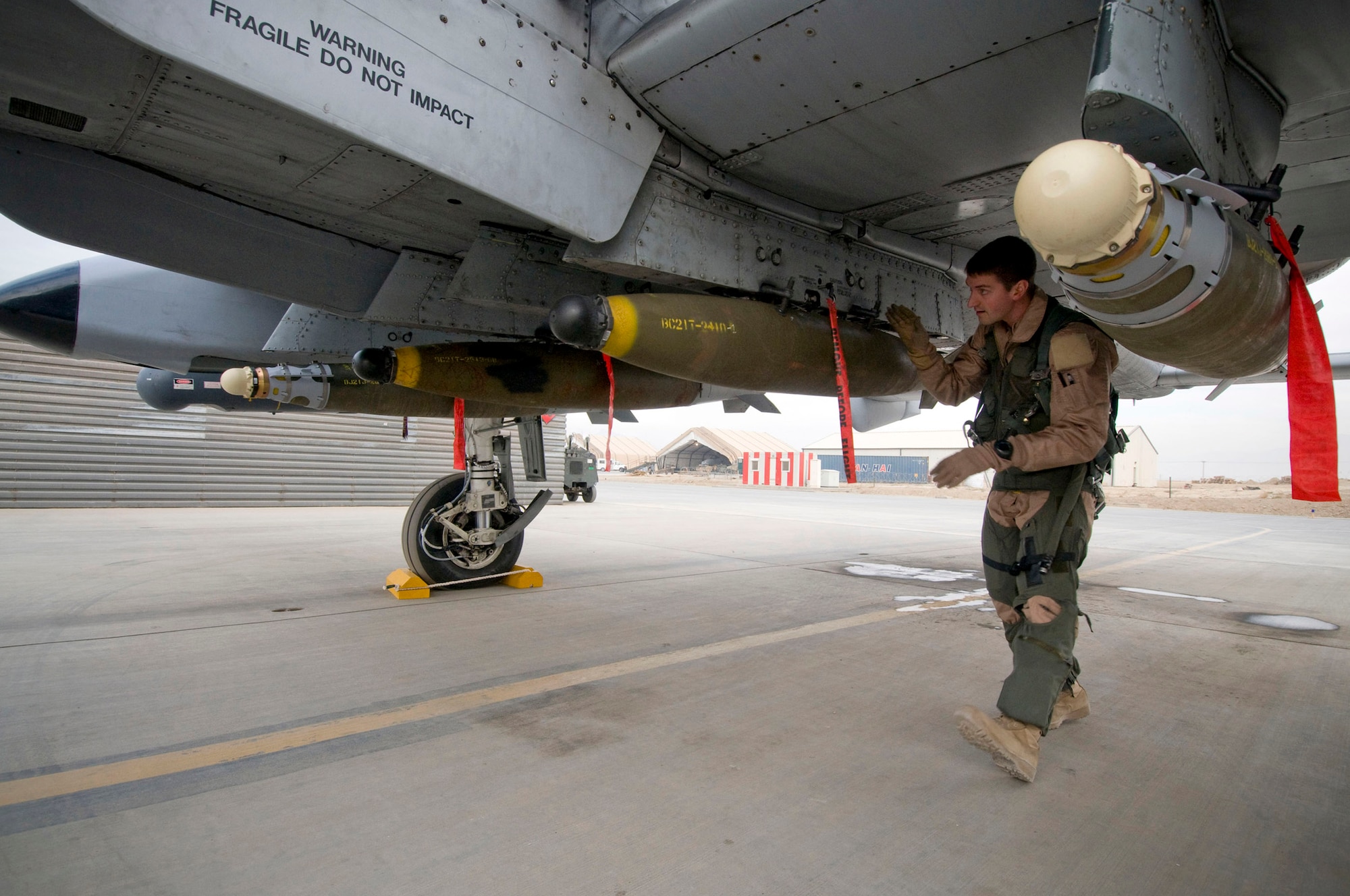 Capt. Eric Fleming performs a preflight walk-around of an A-10 Thunderbolt II Dec. 2 at Bagram Airfield, Afghanistan. Captain Fleming is the assistant wing weapons and tactics officer and an A-10 pilot. He is deployed from Moody Air Force Base, Ga., and hails from Philadelphia. (U.S. Air Force photo/Staff Sgt. Samuel Morse) 