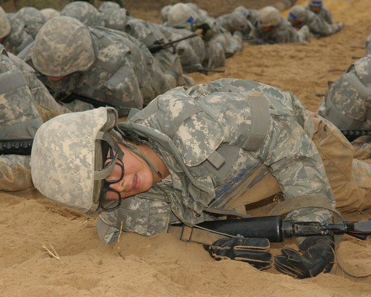 Trainee Maantonette Cabanthe, 323rd Training Squadron, Flight 088, looks for the end of the high crawl, just a few feet away. Basic Expeditionary Airmen Skills and Training known as BEAST kicked off for the first eight-and-a-half-week class of BMT students at Lackland Air Force Base.  (US Air Force photo/Alan Boedeker)
