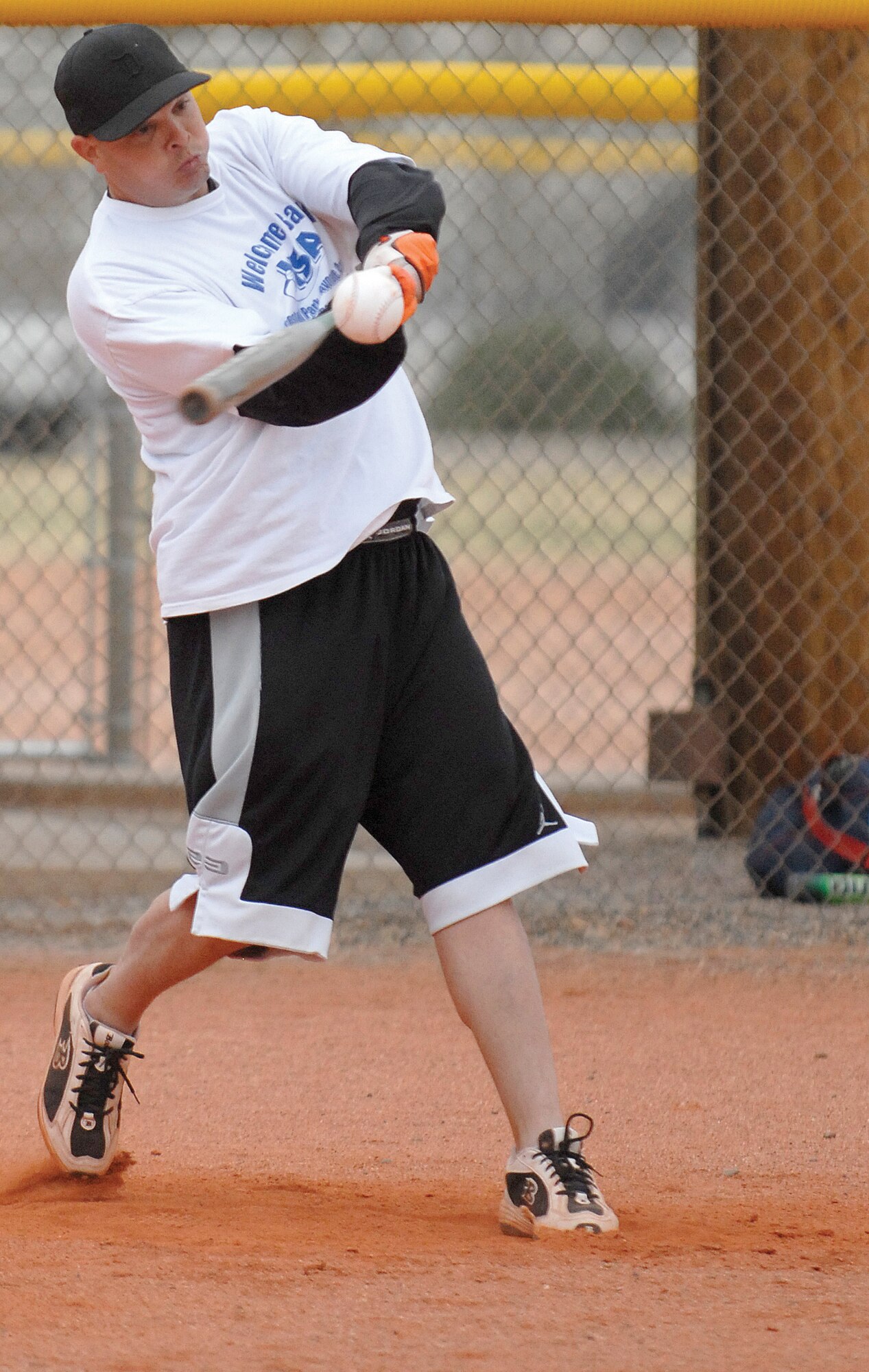 Terry Fryery, 56th Civil Engineer Squadron heavy equipment operator, makes contact with a pitch during the home-run derby Monday.  (U.S. Air Force photo/Deborah Silliman Wolfe)