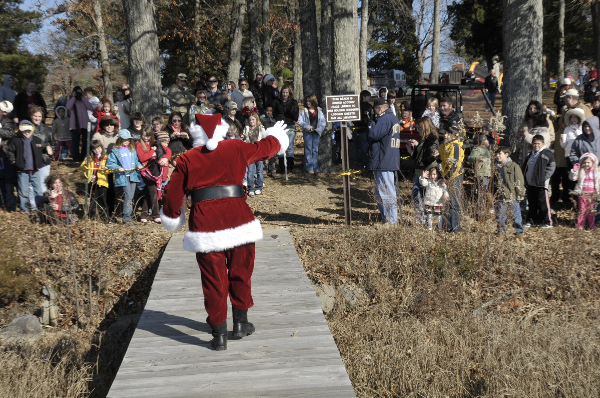 Santa waves to more than 500 children at the end of the dock who attended the annual Children’s Christmas Party Dec. 7. (photo by Rick Goodfriend)