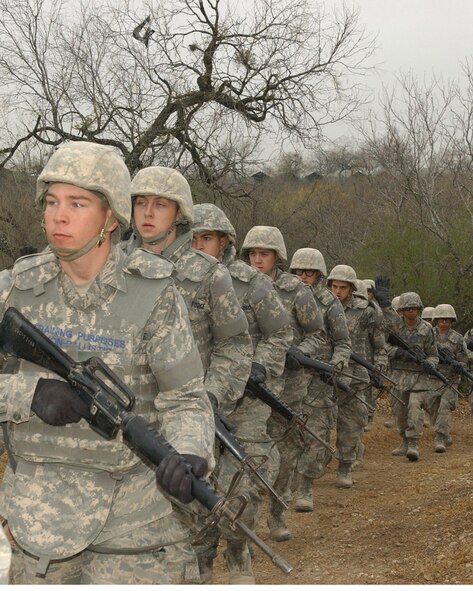 Basic trainees await their next exercise at Basic Expeditionary Airmen Skills and Training.  BEAST kicked off for the first eight-and-a-half-week class of BMT students at Lackland Air Force Base.  With a new emphasis on wingman support and exposure to what they may experience in a deployed hostile environment, BEAST offers something different for trainees.  (US Air Force photo/Alan Boedeker)