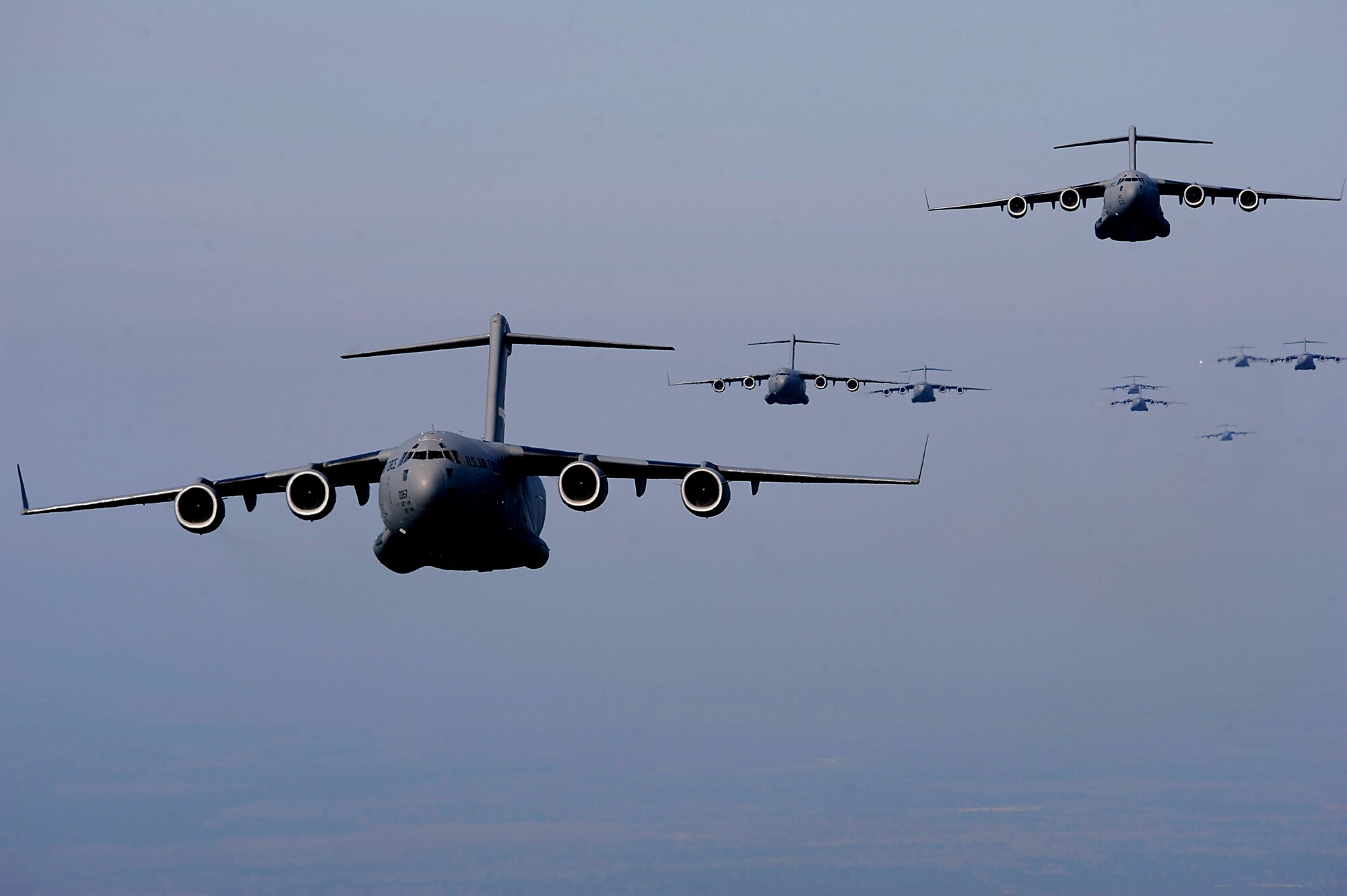 C-17 Globemaster IIIs from the 437th and 315th airlift wings fly in formation Dec. 18 over Charleston, S.C. The C-17s participated in a strategic brigade airdrop exercise involving a 13-ship formation to meet the Army's goal of airdropping a brigade's worth of troops and equipment (about 3,250 Soldiers and 3,450 tons of equipment). The C-17s are from Charleston Air Force Base, S.C. (U.S. Air Force photo/Tech. Sgt. Jeremy Lock)