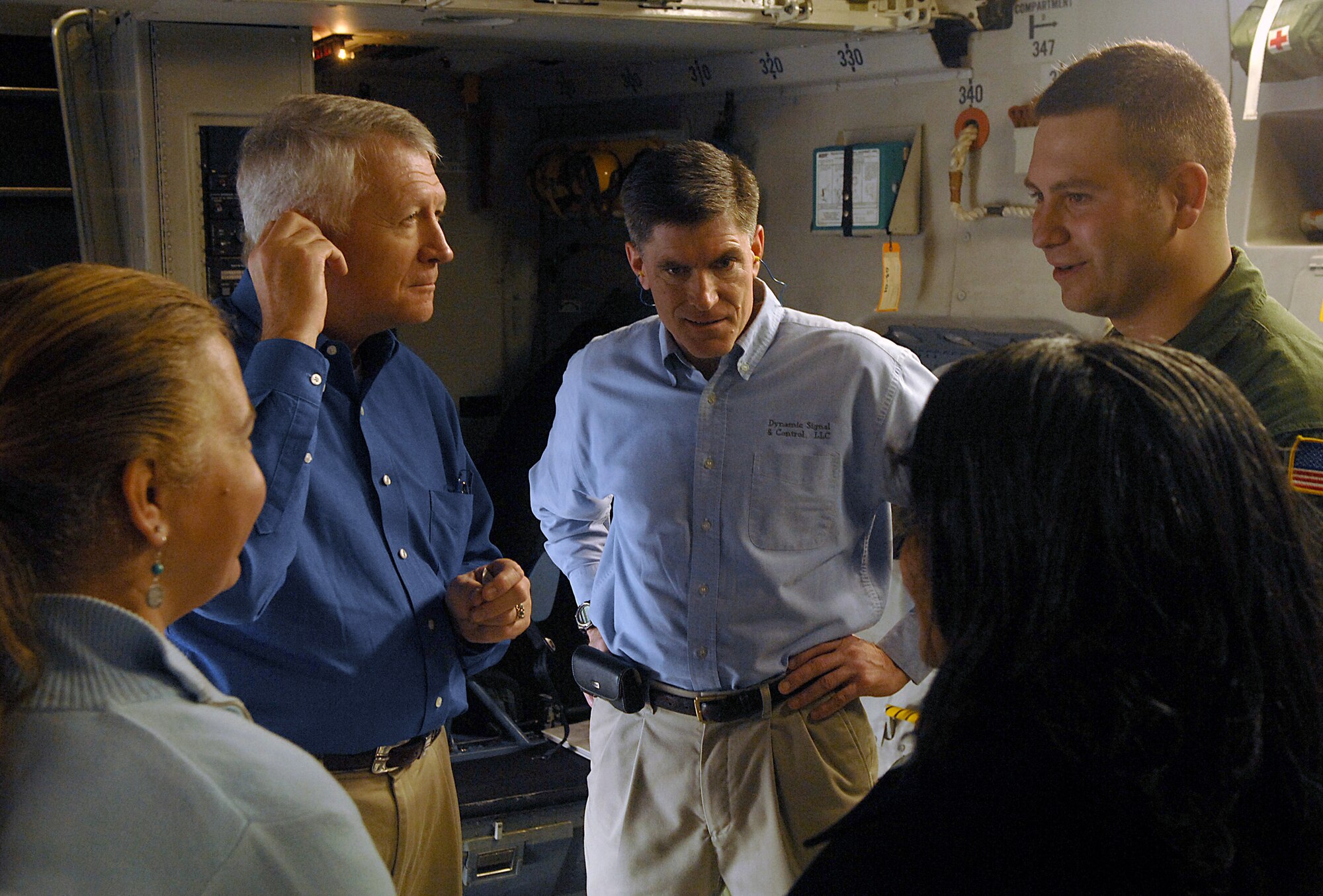 Charleston civic leaders get a tour of the C-17 Globemaster III during a strategic brigade airdrop exercise involving a 13-ship formation Dec. 18 from Charleston Air Force Base, S.C. C-17s must be able to meet the Army's goal of airdropping a brigade's worth of troops and equipment (about 3,250 Soldiers and 3,450 tons of equipment). This multiship training demonstrates the teamwork of active-duty Airmen, reservists and civilians to be mission ready when the nation needs this critical capability. (U.S. Air Force photo/Tech. Sgt. Jeremy Lock)