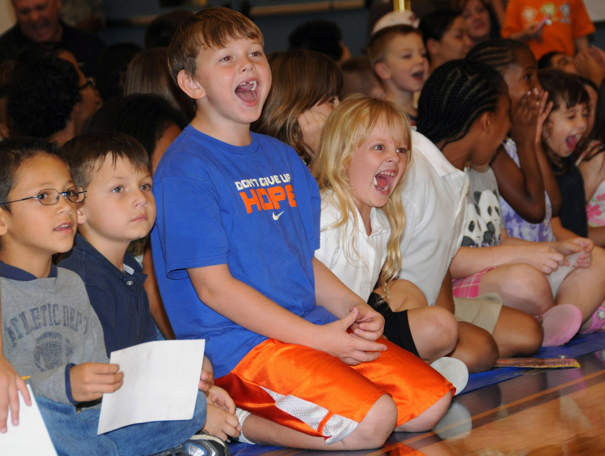 Children cheer on the Harlem Globetrotters during a game against the Washington Generals Dec. 15 at Andersen Air Force Base, Guam. (U.S. Air Force photo/Staff Sgt. Jamie Lessard) 
