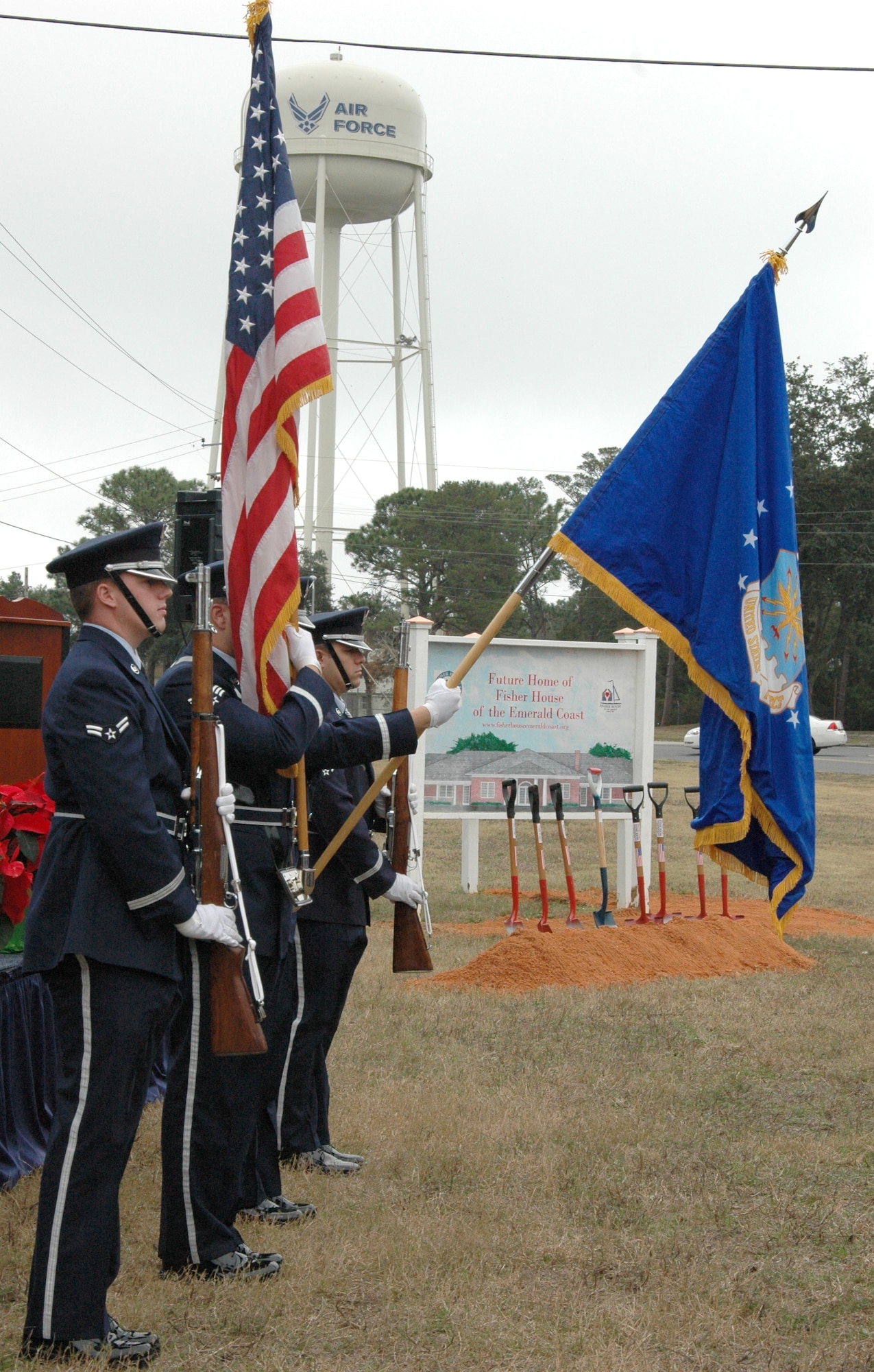 EGLIN AIR FORCE BASE, Fla. -- The Team Eglin Honor Guard presents the colors during the groundbreaking ceremony for the Emerald Coast Fisher House here. There are currently 40 Fisher Houses worldwide and they provide a home-away-from-home for the families of servicemembers while loved ones are receiving medical treatment at military and Veteran Affairs facilities. (U.S. Air Force photo/Staff Sgt. Stacia Zachary)