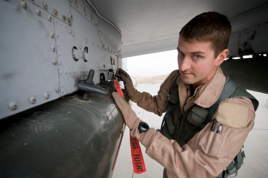 Capt. Eric Fleming, Assistant Wing Weapons and Tactics and A-10 pilot, performs a preflight inspection of a GBU-12 at Bagram Air Field, Afghanistan, Dec. 2. As the pilot of the aircraft, he has the final authority to say the aircraft and its ordinance is "good to go." Captain Fleming is deployed from Moody Air Force Base, Ga., and hails from Philadelphia, Pa. (U.S. Air Force photo by Staff Sgt. Samuel Morse)(Released)