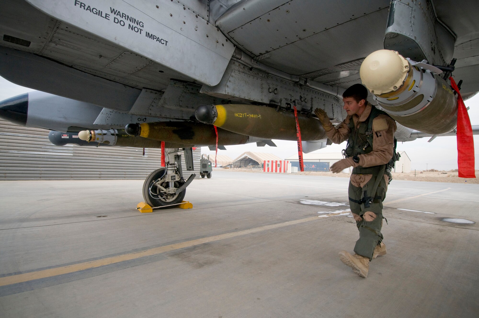 Capt. Eric Fleming, A-10 pilot, performs a preflight walk-around at Bagram Air Field, Afghanistan, Dec. 2. These preflight checks help to minimize the number of in-flight emergencies by catching small problems before they become big problems. Captain Fleming is deployed from Moody Air Force Base, Ga., and hails from Philadelphia, Pa. (U.S. Air Force photo by Staff Sgt. Samuel Morse)(Released)