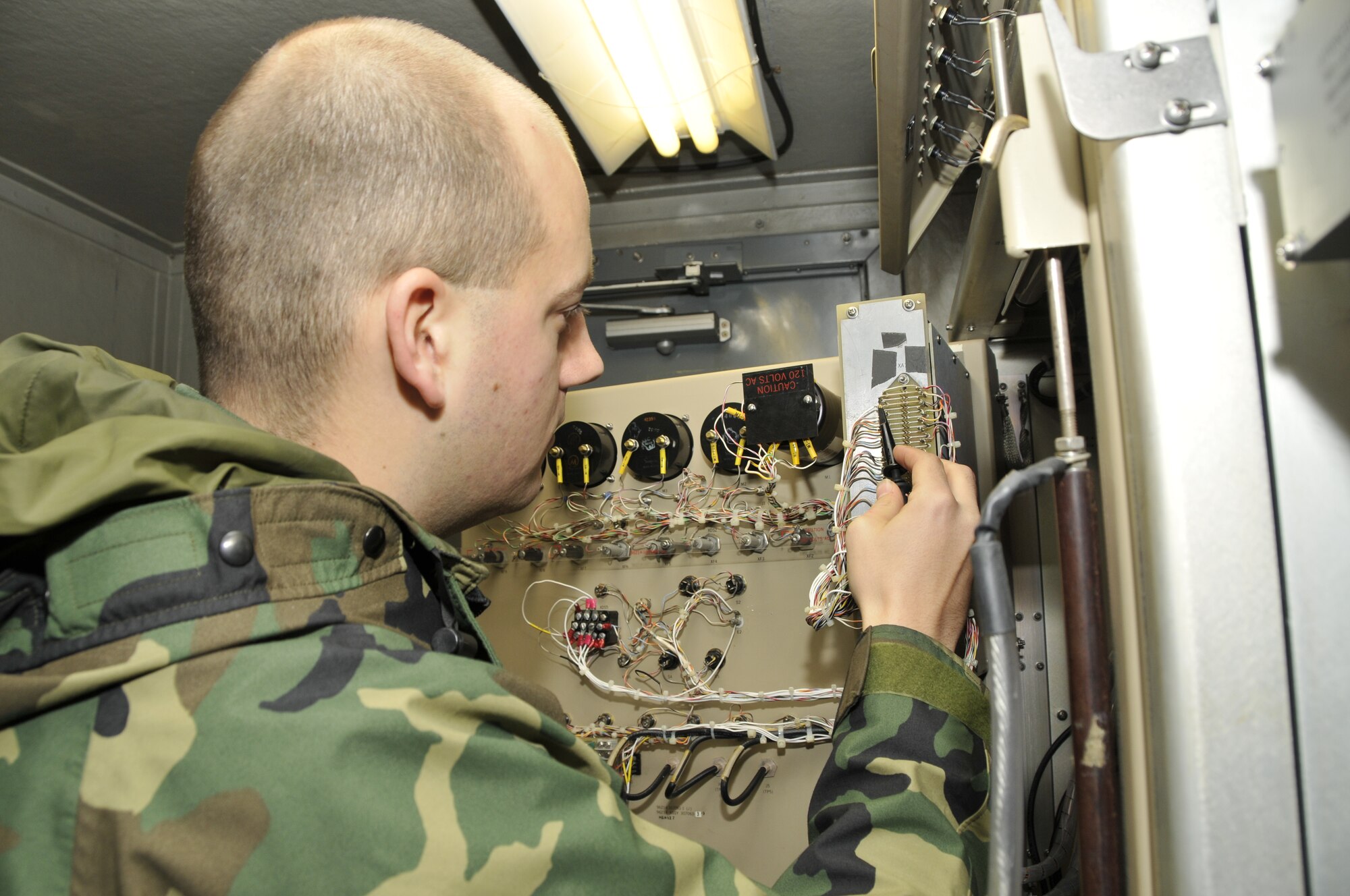 Staff Sgt. James Hammond, 48th Communications Squadron NCOIC of ground radar systems, performs a daily receiver check on the airport surveillance radar Dec. 9 at RAF Lakenheath, England. Ground radar systems craftsman inspect and repair the radar early morning every day before being turned over to radar approach control for that days flying operations.(U.S. Air Force photo by Airman 1st Class Perry Aston)