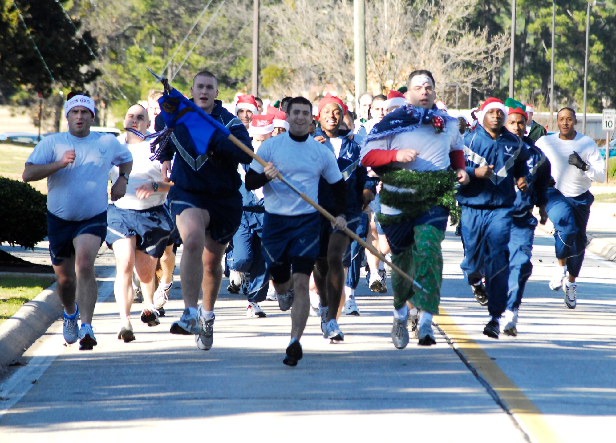 Airmen from the 43rd Communications Squadron run in the Toy Trot on Pope Dec. 12. This was one of Pope’s quarterly wing runs but included some extra holiday spirit. (U.S. Air Force Photo by Staff Sgt. Jon LaDue)