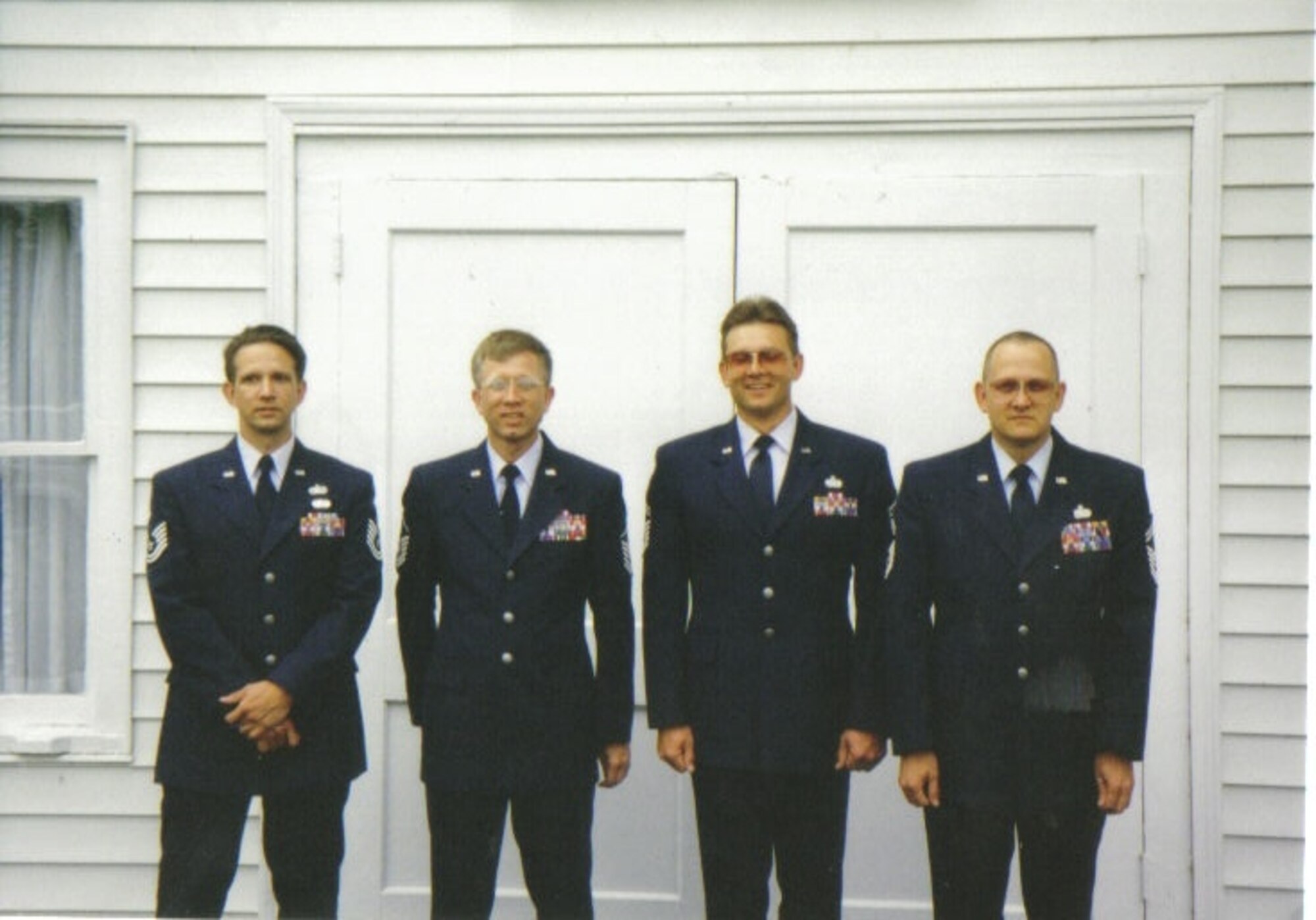 From left to right: Curtis, Kevin, Craig and Douglas Walker. This is the only photo of all the Walker boys in uniform. They were
together at the funeral service for their father in Rome, Pa., in 1997. Curtis was the first to enlist in 1978, with the remaining
three brothers following shortly thereafter. Mr. Walker said he would die before seeing one of his boys out of the service.