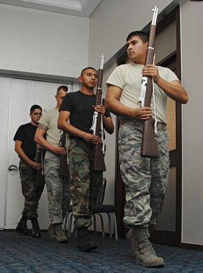 Members of the Incirlik Drill Team march in formation during practice at Incirlik Consolidated Club, Dec. 16. The drill team is comprised of four dedicated members from the base honor guard.