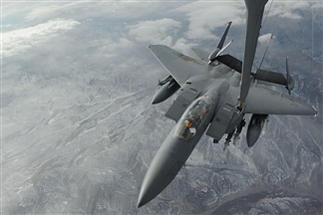 A U.S. Air Force KC-10 Extender tanker from the 908th Expeditionary Aerial Refueling Squadron refuels an F-15E Strike Eagle from the 391st Expeditionary Fighter Squadron over Afghanistan on Dec. 15, 2008.  