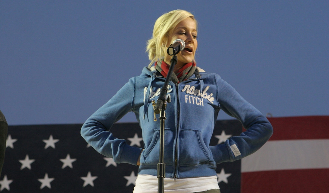 Country-music singer and songwriter Kellie Pickler performs for service members during the United Service Organization?s Holiday Tour here Dec. 19. The 2006 American Idol contestant was joined by musician Kid Rock Zac Brown, and comedians John Bowman, Kathleen Madigan, Lewis Black and Tichina Arnold. The group is set to tour five military bases throughout the Middle East boosting troops? morale. ?It?s amazing being out here supporting our military,? said Pickler. ?I?m taking a little piece of home out to them.? The performers entertained the crowd all afternoon and into the night. ?It was an awesome show,? said Sgt. Joshua G. Martin, 24, Lincoln, Neb., motor transportation operator, Transportation Company, Combat Logistics Battalion 2, 1st Marine Logistics Group. ?I hope they can come out here and do it again.?