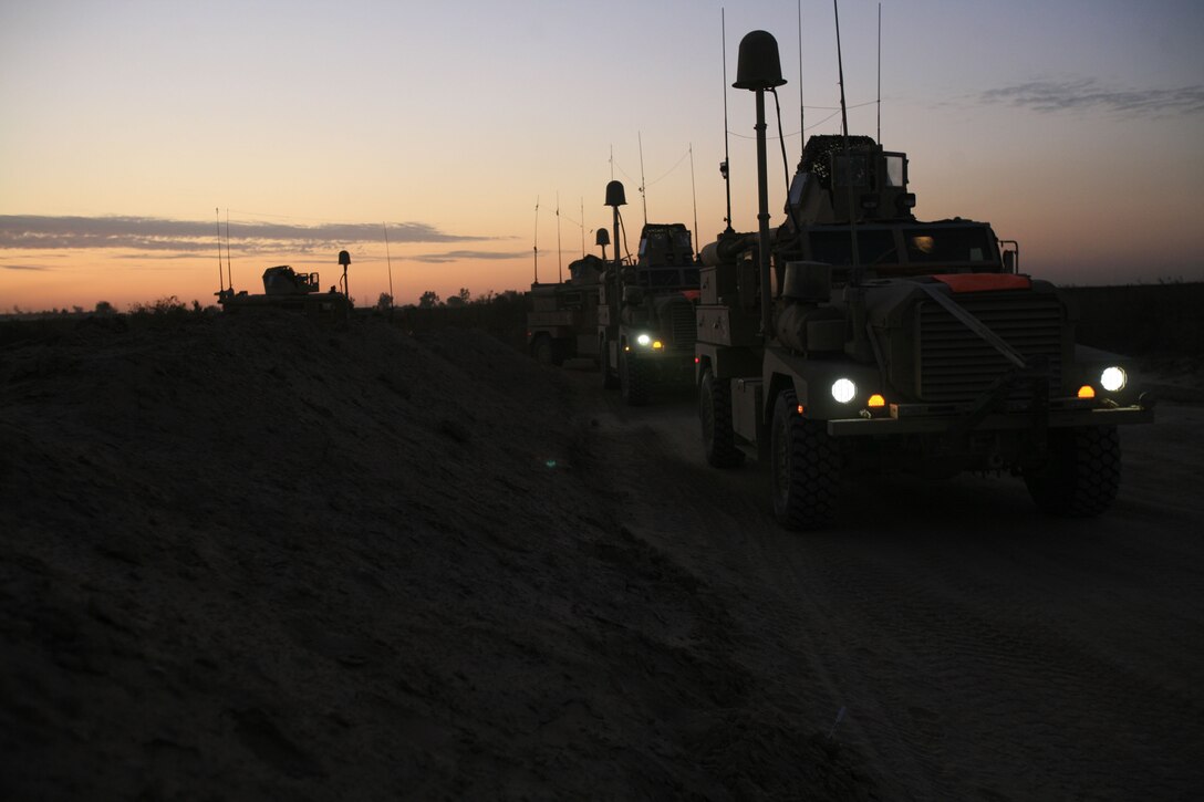 Lance Cpl. Marcel V. Campos, 20, from Long Beach, Calif., a Logistic Vehicle System operator with Motor Transportation Company, Combat Logistics Battalion 5, 1st Marine Logistics Group, operates the LVS hydraulic systems during a combat logistics patrol here Dec. 19. Motor T. Co. delivered fuel, food and supplies to the Marines at Observation Post Viking while Security Co. escorted them along the route, ensuring them a safe passage to their destination.