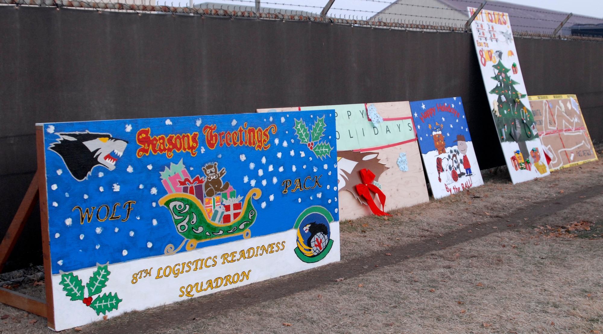 KUNSAN AIR BASE, Republic of Korea - Base squadrons displayed their holiday cards during the annual Christmas tree lighting ceremony at Kunsan Air Base, Republic of Korea Dec. 15. The annual ceremony is held to help boost morale and celebrate the holidays. (U.S. Air Force photo by: Senior Airman Dana Hill)