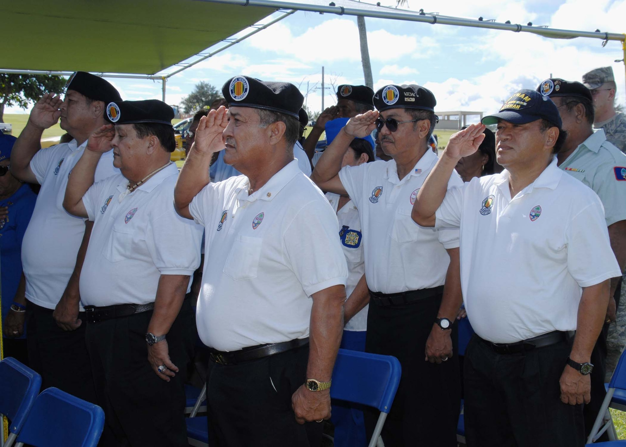 ANDERSEN AIR FORCE BASE, Guam -- Members from the Vietnam Veterans of America salute throughout the National Anthem during the Operation Linebacker II Ceremony at the Arc Light Memorial Park here Dec. 18. The ceremony commemorates its 36th anniversary of the campaign that led to the end of the 11-year Vietnam War. (U.S. Air Force photo by Senior Airman Sonya Croston)