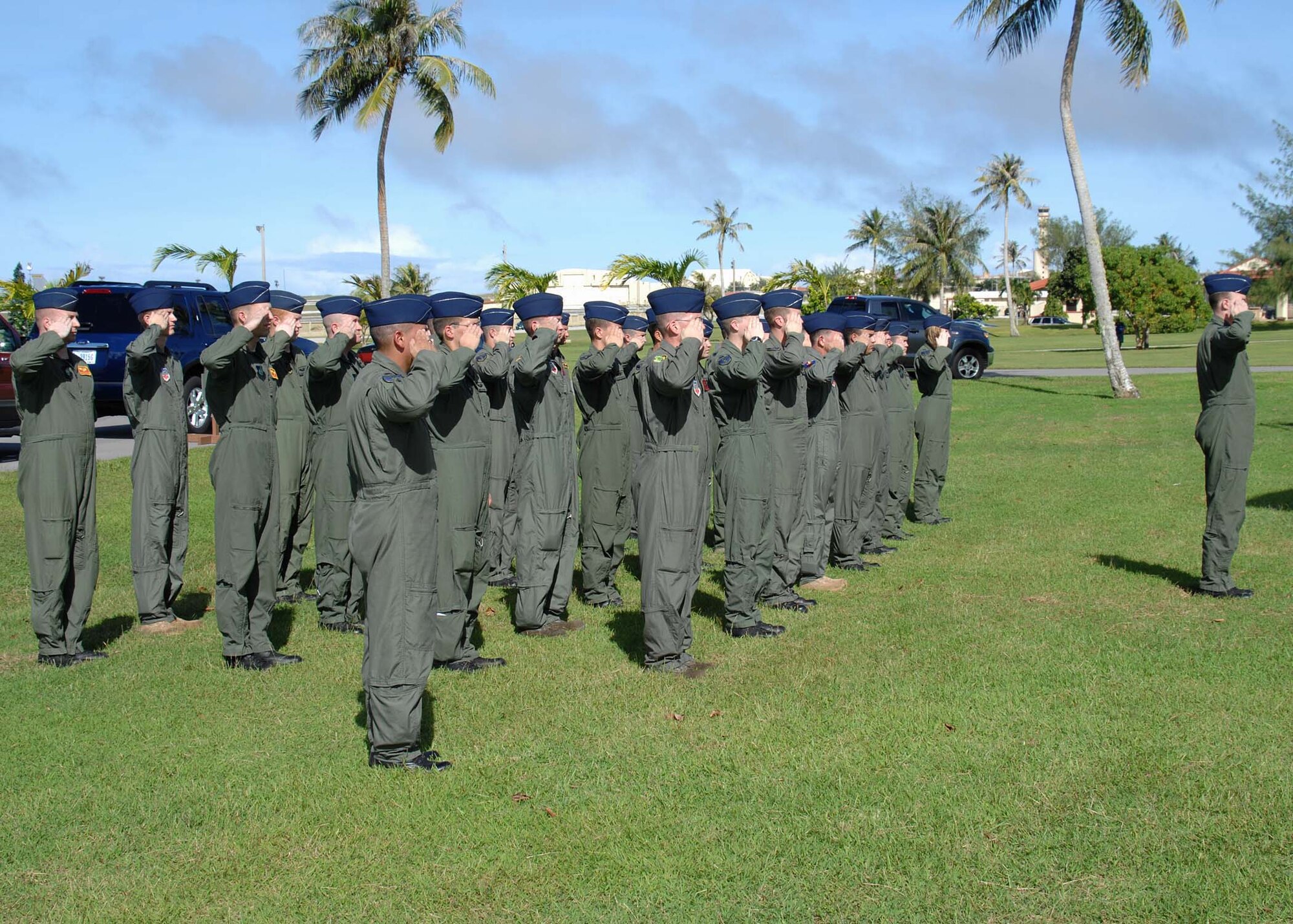 ANDERSEN AIR FORCE BASE, Guam -- Aircrew members from the 36th Expeditionary Bomb Squadron render a salute during the National Anthem at the Operation Linebacker II Ceremony at Arc Light Memorial Park here Dec. 18. During the ceremony, 33 Airmen stood in formation, each representing an Airman who died during Operation Linebacker II. (U.S. Air Force photo by Senior Airman Sonya Croston)
