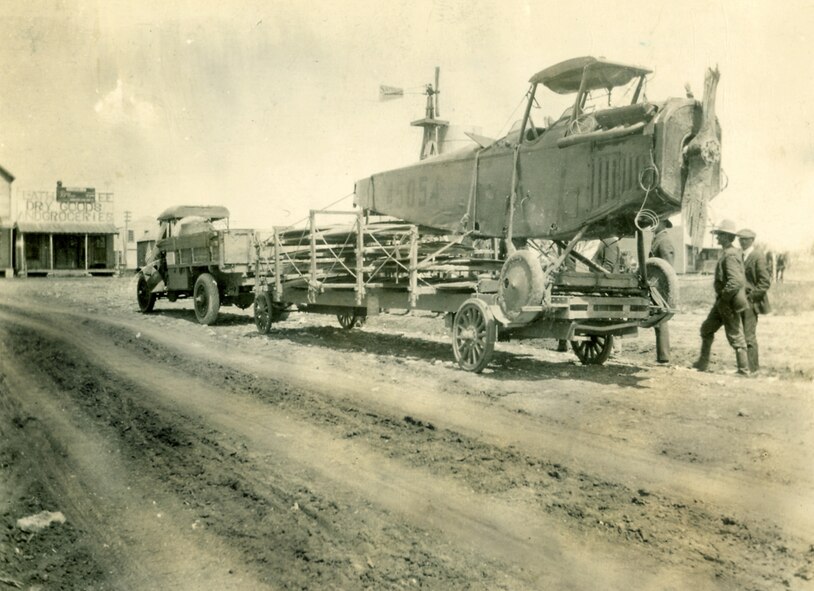 After the "Jenny" crashed into a fence, the caption on the back this nearly 90-year-old photo that showed the wreckage being towed from town read, "Eden's first airplane leaving in disgrace." (Courtesy of Angelo State University)