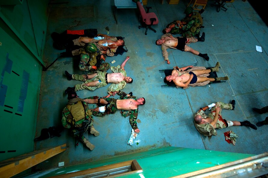 Pararescue students work as fast as they can during a mass casualty exercise that simulated an explosion on a base at 4 in the morning. The number of wounded can be overwhelming in this realistic training scenerio.  (U.S Air Force Photo by Tech Sgt. Matthew Hannen)