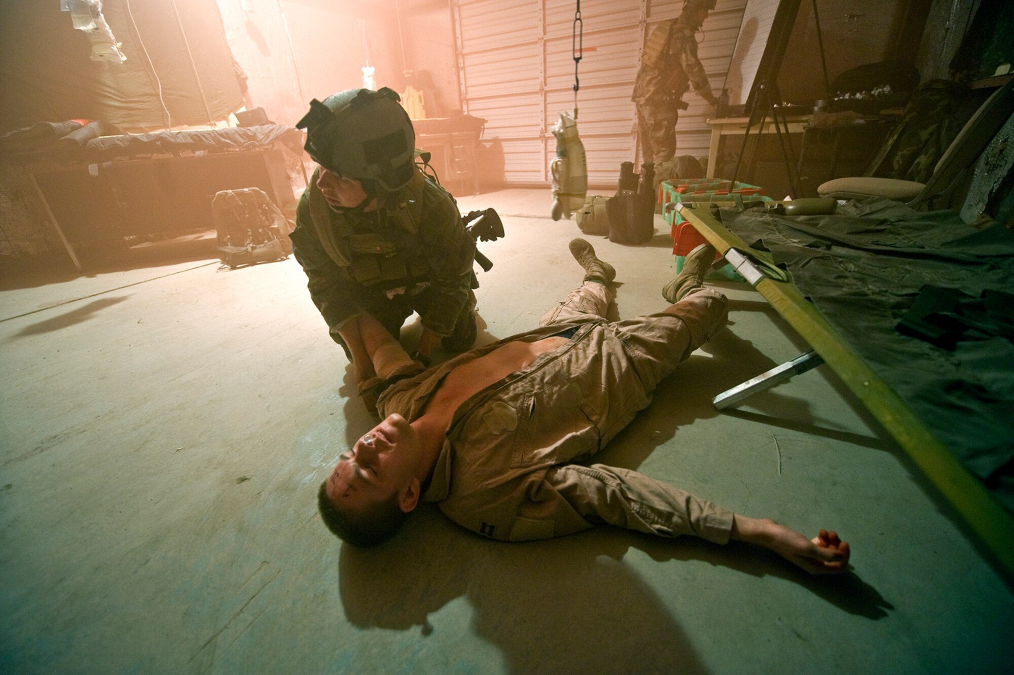 Pararescue students work as fast as they can during a mass casualty exercise that simulated an explosion on a base at 4 in the morning. Rogers carries an injured Airman to safety and then works feverishly to treat the injuries. (U.S Air Force Photo by Tech Sgt. Matthew Hannen)